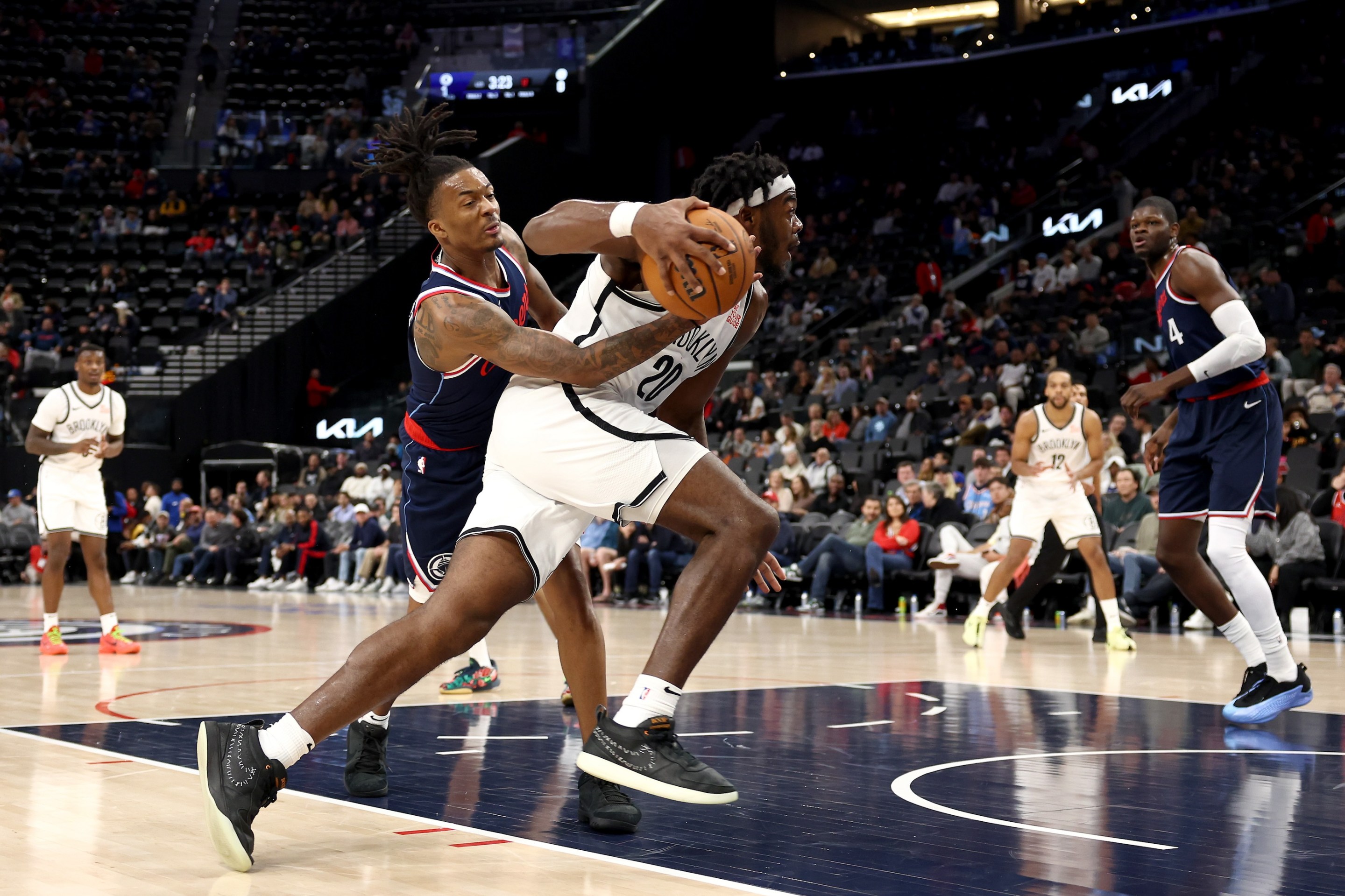 Day'Ron Sharpe #20 of the Brooklyn Nets drives to the basket against Bones Hyland #5 of the Los Angeles Clippers during the fourth quarter at Intuit Dome on January 15, 2025.