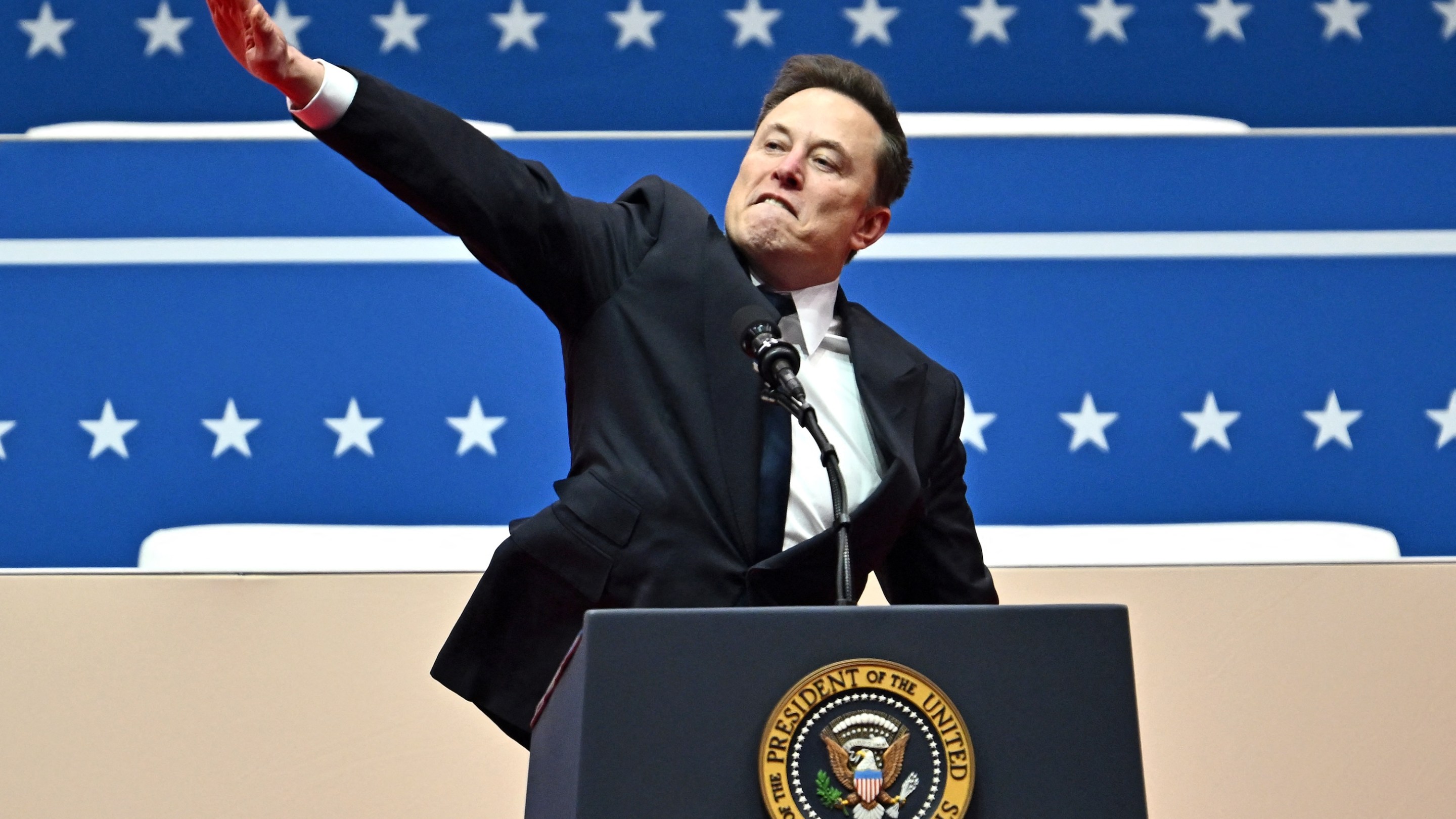 Tesla and SpaceX CEO Elon Musk gestures as he speaks during the inaugural parade inside Capitol One Arena, in Washington, DC, on January 20, 2025. (Photo by ANGELA WEISS / AFP)