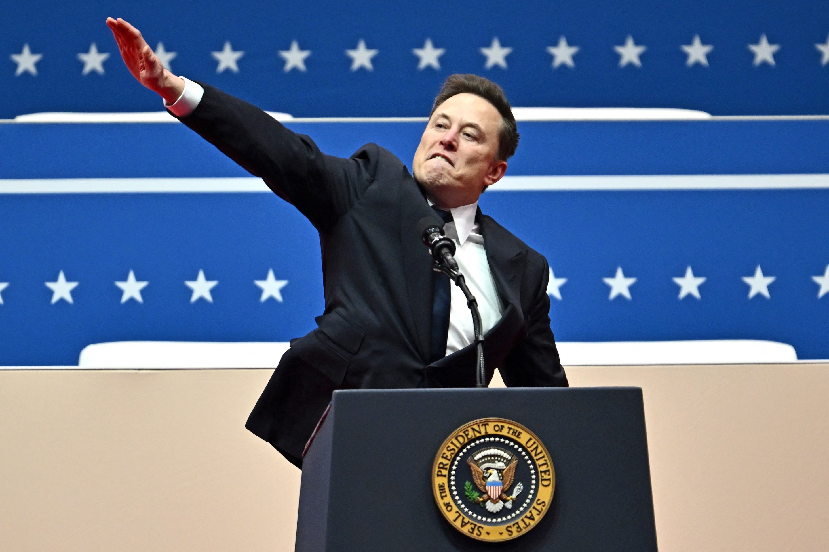 Tesla and SpaceX CEO Elon Musk gestures as he speaks during the inaugural parade inside Capitol One Arena, in Washington, DC, on January 20, 2025. (Photo by ANGELA WEISS / AFP)