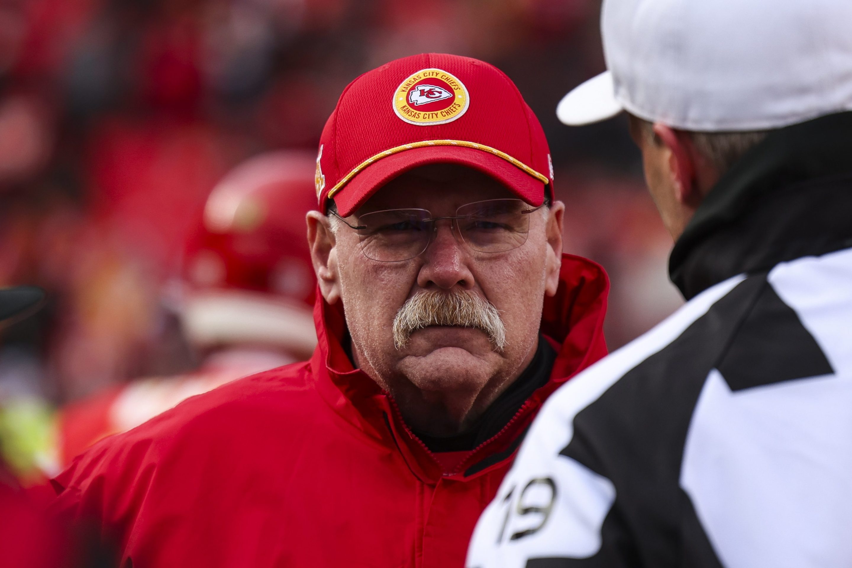 Andy Reid of the Kansas City Chiefs looks on from the field during warmups prior to an NFL football AFC divisional playoff game against the Houston Texans.