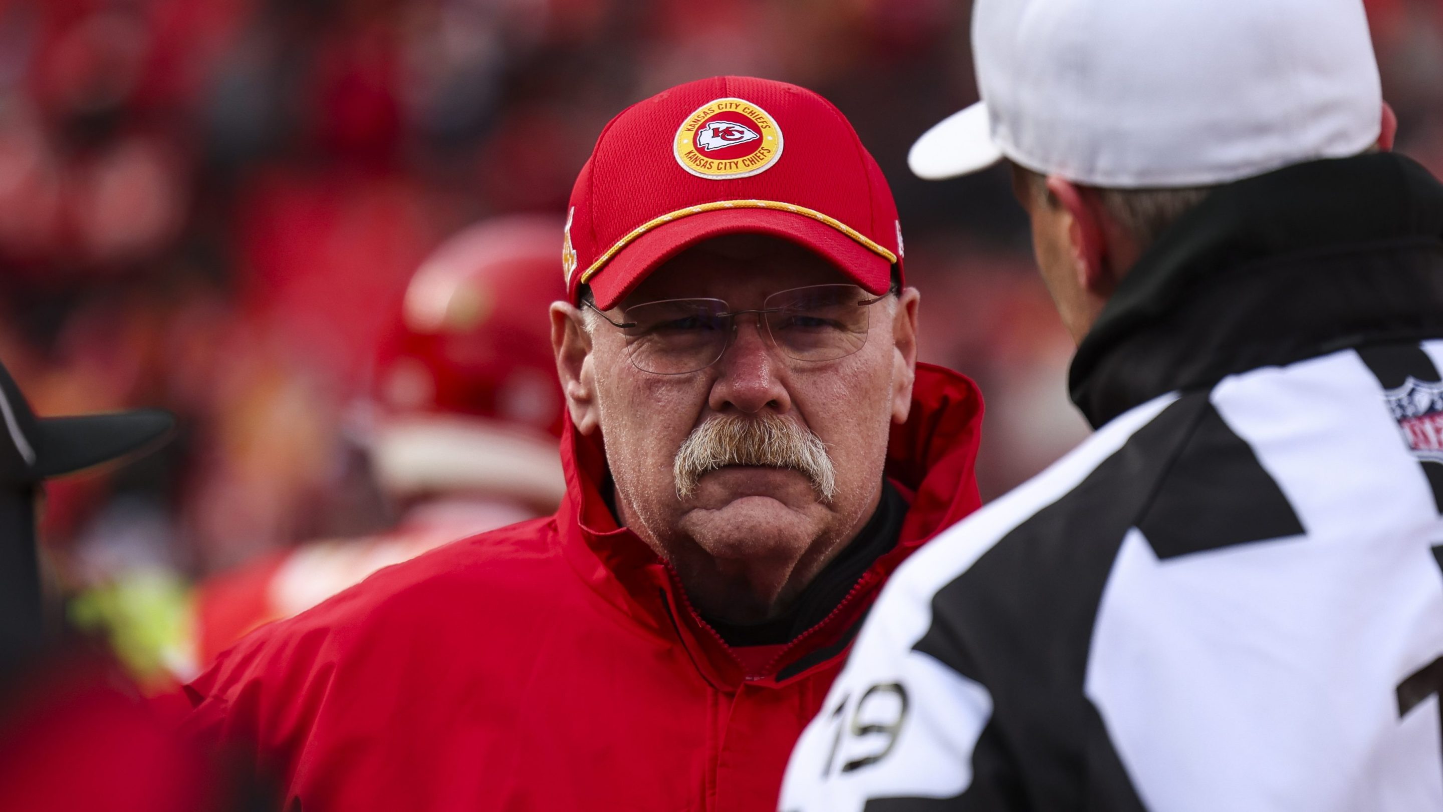 Andy Reid of the Kansas City Chiefs looks on from the field during warmups prior to an NFL football AFC divisional playoff game against the Houston Texans.