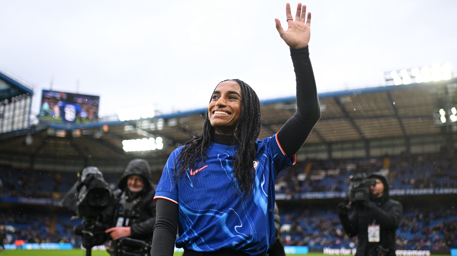 Naomi Girma of Chelsea waves to the crowd as she is unveiled as a Chelsea player prior to the Barclays Women's Super League match between Chelsea FC and Arsenal at Stamford Bridge on January 26, 2025 in London, England.