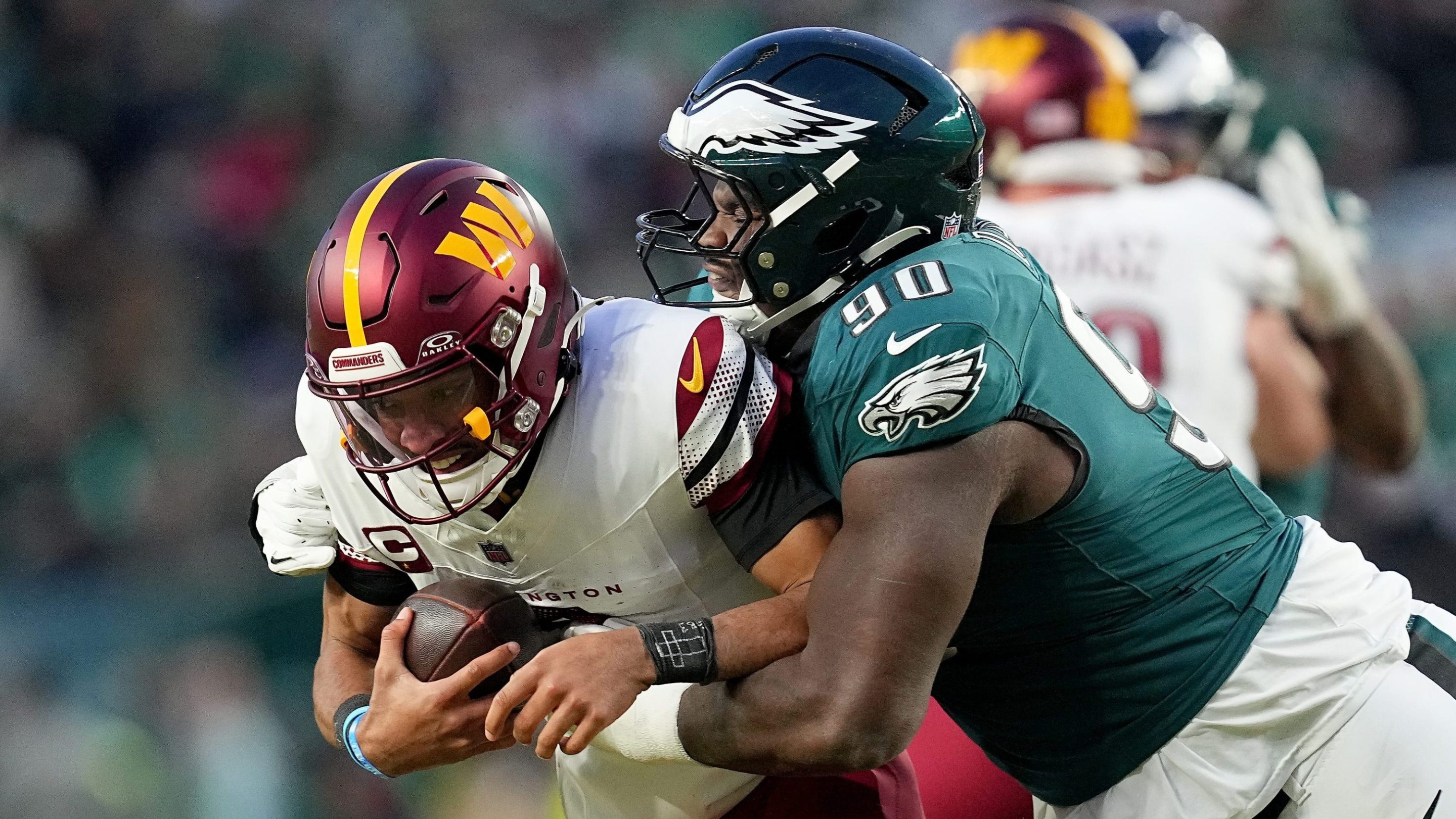 Jordan Davis #90 of the Philadelphia Eagles sacks Jayden Daniels #5 of the Washington Commanders during the third quarter in the NFC Championship Game at Lincoln Financial Field on January 26, 2025 in Philadelphia, Pennsylvania.