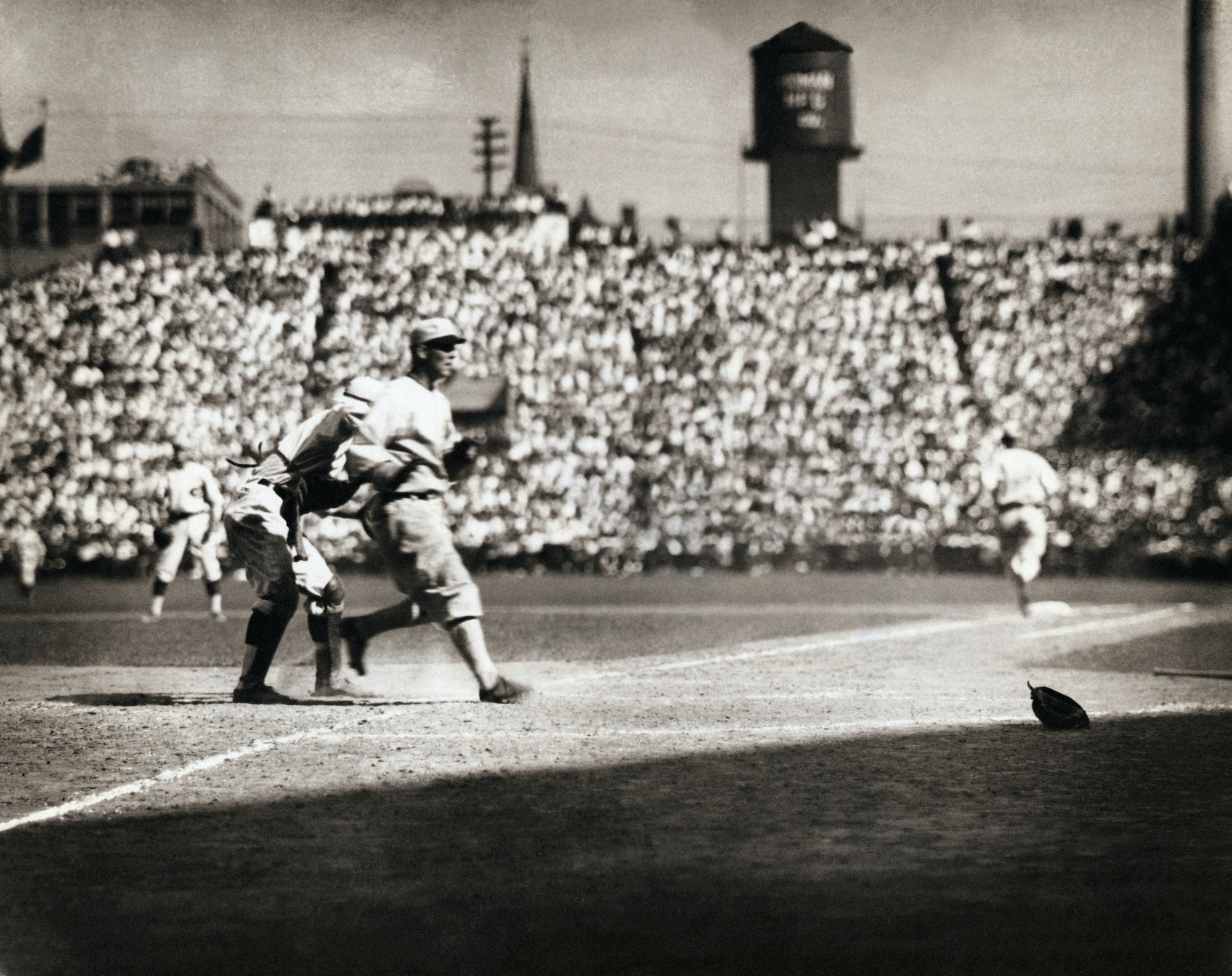 Bill Rariden of the Cincinnati Reds tags Buck Weaver of the Chicago White Sox out at home plate in the second game of the 1919 World Series at Crosley Field.