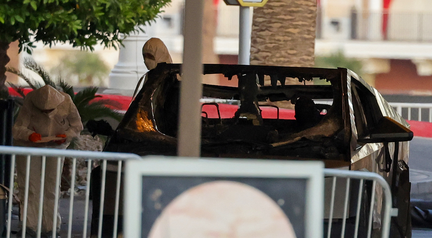 First responders wearing Hazmat gear investigate a Tesla Cybertruck that exploded in front of the entrance to the Trump International Hotel & Tower Las Vegas on Jan. 01, 2025 in Las Vegas, Nevada.