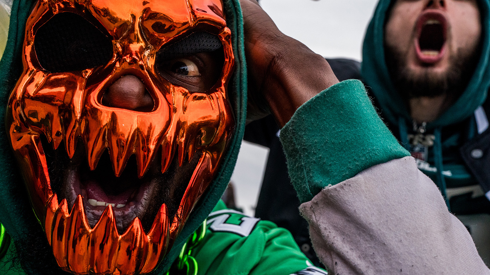 PHILADELPHIA, UNITED STATES - JANUARY 26: A Philadelphia Eagles fan in a mask at Xfinity Live during the NFL NFC Championship in Philadelphia, Pennsylvania, United States on January 26, 2025. The Philadelphia Eagles defeated the Washington Commanders to advance to the Super Bowl.