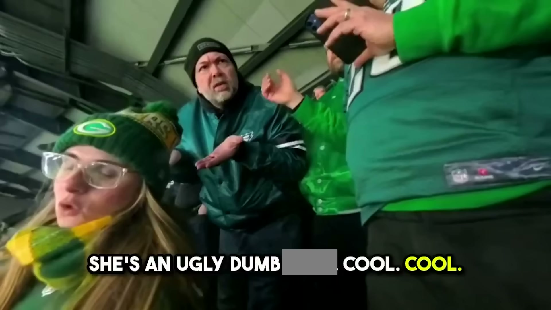 An Eagles fan yells at Packers fans at the game