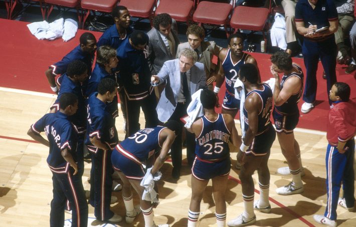 LANDOVER, MD - CIRCA 1983: Head coach Hubie Brown of the New York Knicks talks with his player during a time out against the Washington Bullets during an NBA basketball game circa 1983 at the Capital Centre in Landover, Maryland. Brown coached the Knicks from 1982-87