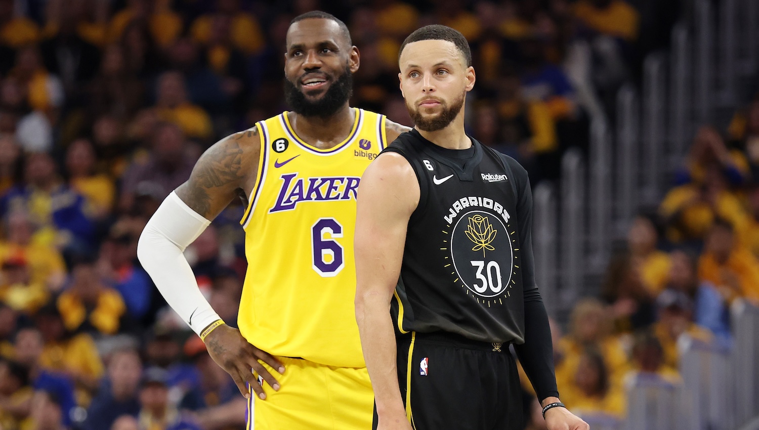 SAN FRANCISCO, CALIFORNIA - MAY 02: LeBron James #6 of the Los Angeles Lakers stands next to Stephen Curry #30 of the Golden State Warriors during the second quarter in game one of the Western Conference Semifinal Playoffs at Chase Center on May 02, 2023 in San Francisco, California. NOTE TO USER: User expressly acknowledges and agrees that, by downloading and or using this photograph, User is consenting to the terms and conditions of the Getty Images License Agreement. (Photo by Ezra Shaw/Getty Images)