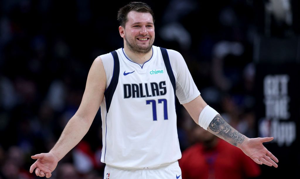 A photo of Dallas Mavericks player Luka Doncic shurgging on court during a game