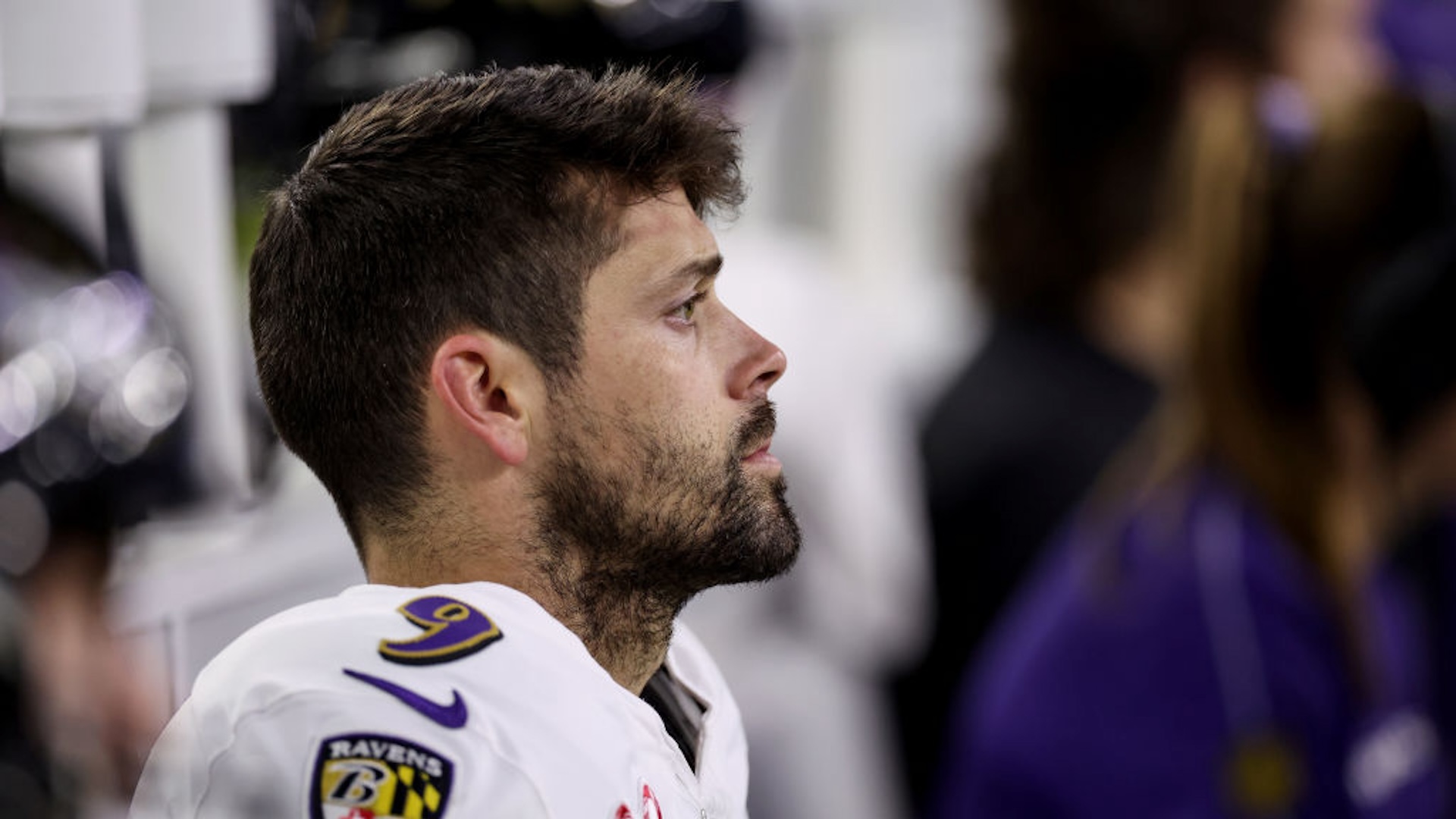 Justin Tucker #9 of the Baltimore Ravens sits on the bench in the second half against the Houston Texans at NRG Stadium on December 25, 2024 in Houston, Texas.