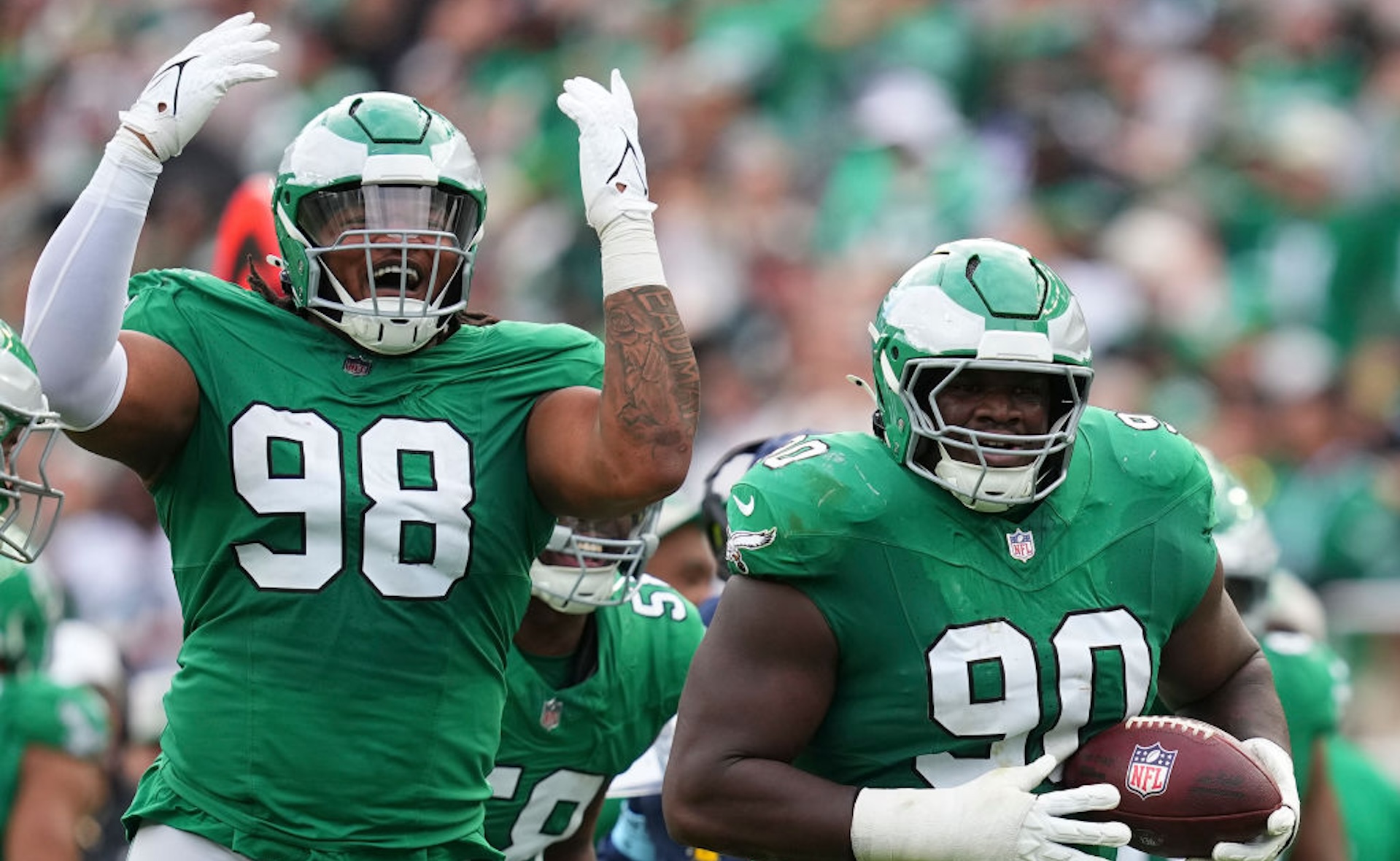 Jordan Davis #90 and Jalen Carter #98 of the Philadelphia Eagles react against the Dallas Cowboys at Lincoln Financial Field on December 29, 2024 in Philadelphia, Pennsylvania.