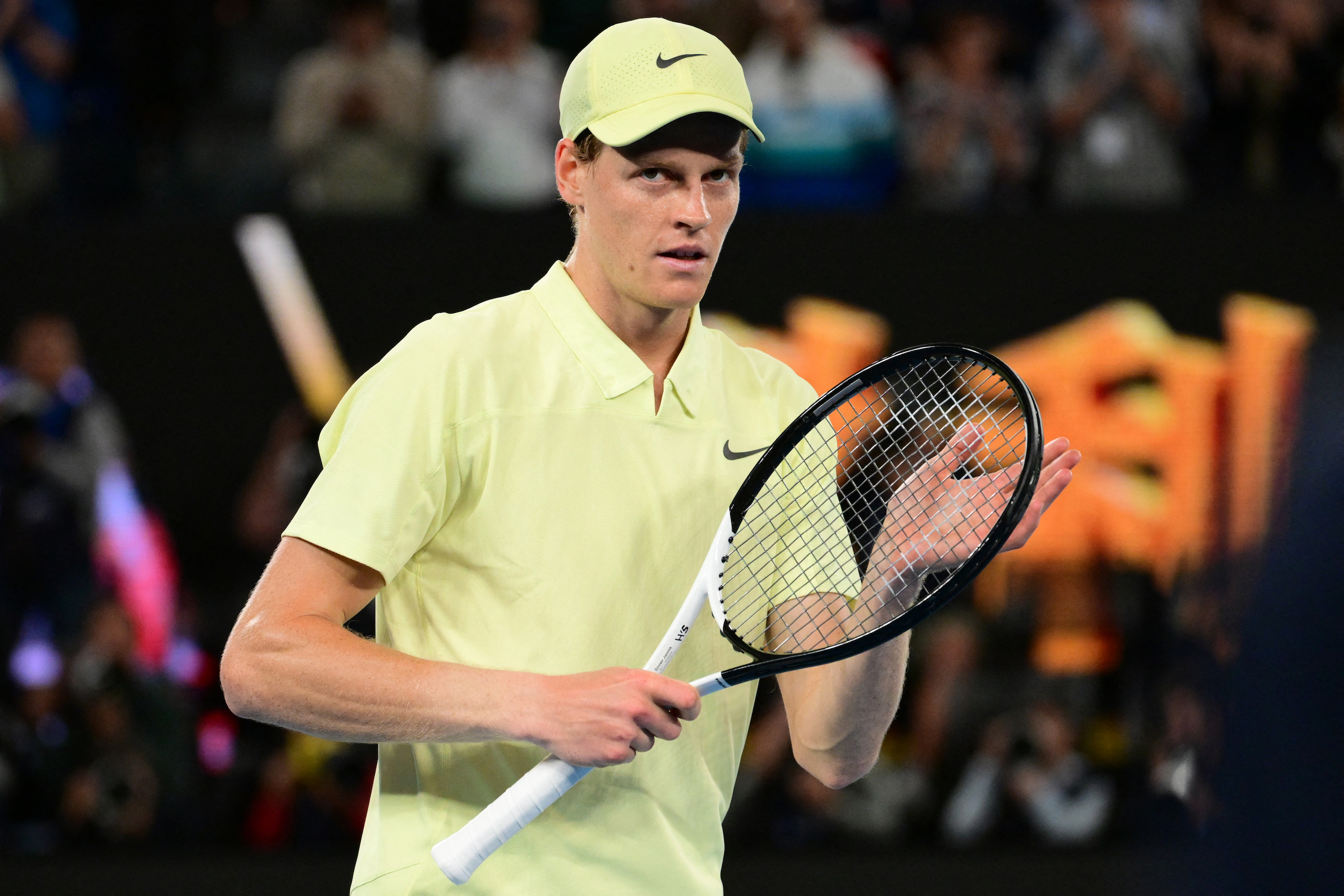 Italy's Jannik Sinner celebrates victory over Australia's Alex De Minaur after their men's singles quarter-final match on day eleven of the Australian Open tennis tournament in Melbourne on January 22, 2025. (Photo by Yuichi YAMAZAKI / AFP) /