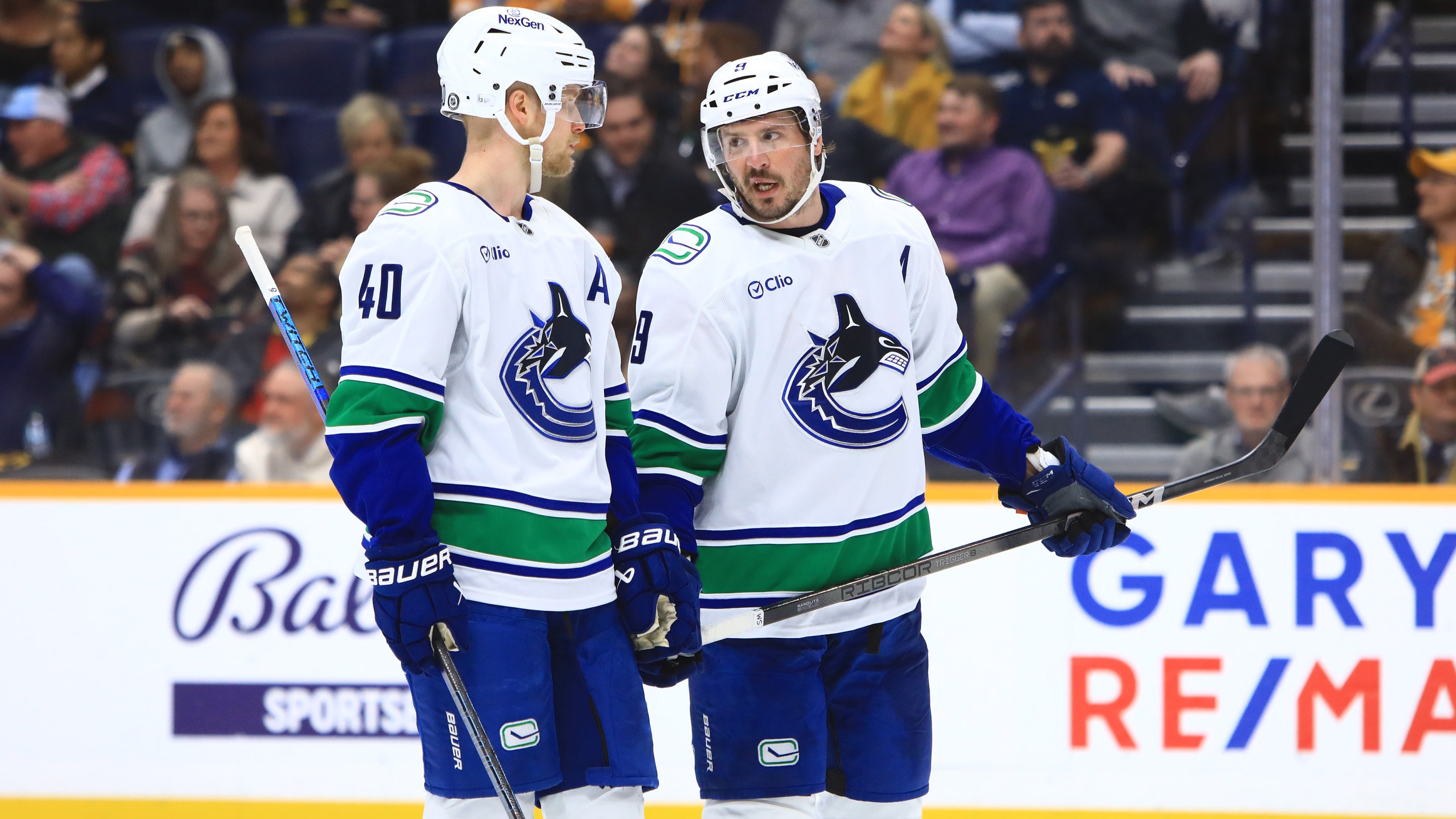 Vancouver Canucks center Elias Pettersson (40) and Canucks center J.T. Miller (9) talk during the NHL game between the Nashville Predators and Vancouver Canucks, held on January 29, 2025, at Bridgestone Arena in Nashville, Tennessee.