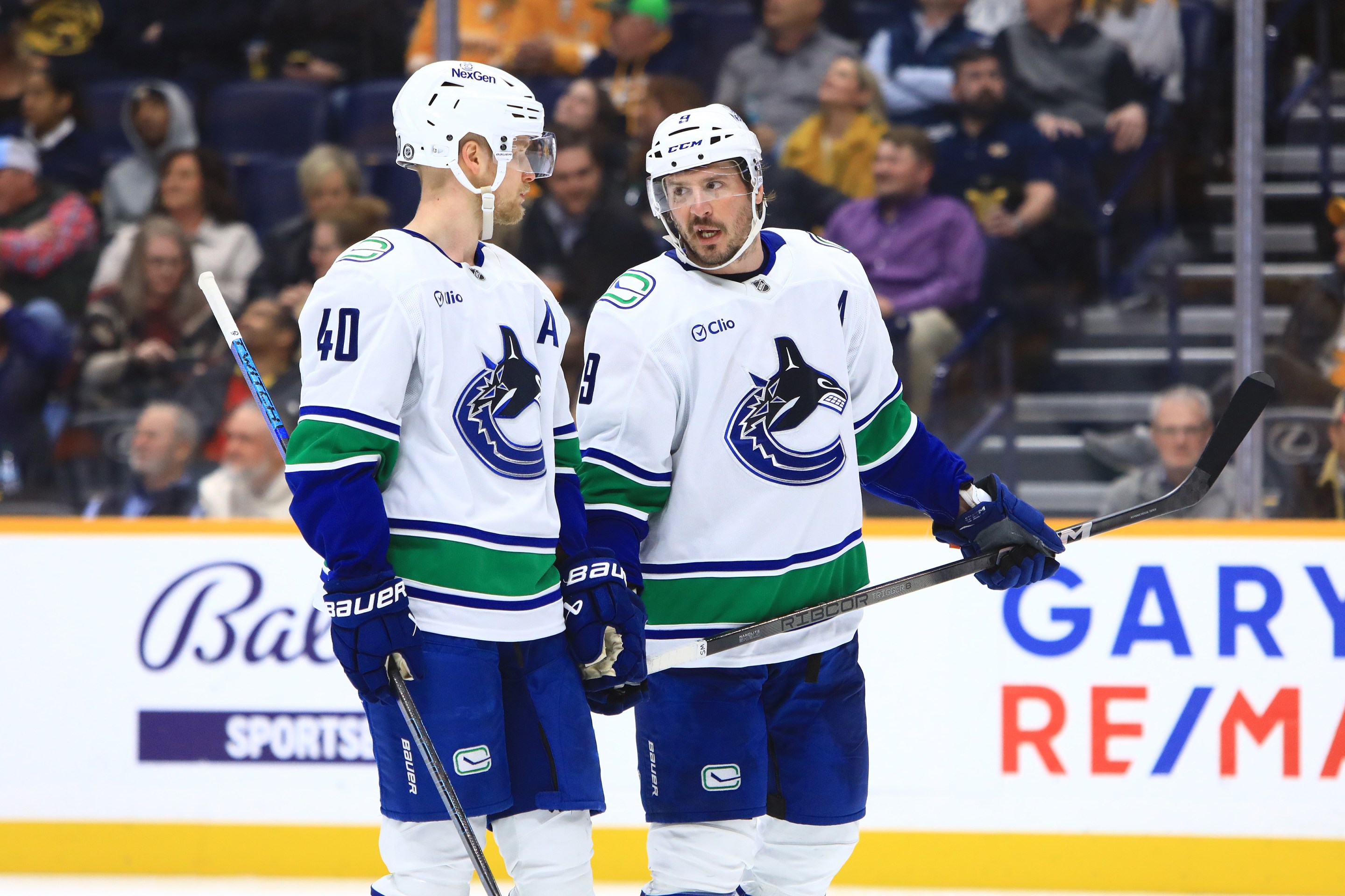 Vancouver Canucks center Elias Pettersson (40) and Canucks center J.T. Miller (9) talk during the NHL game between the Nashville Predators and Vancouver Canucks, held on January 29, 2025, at Bridgestone Arena in Nashville, Tennessee.