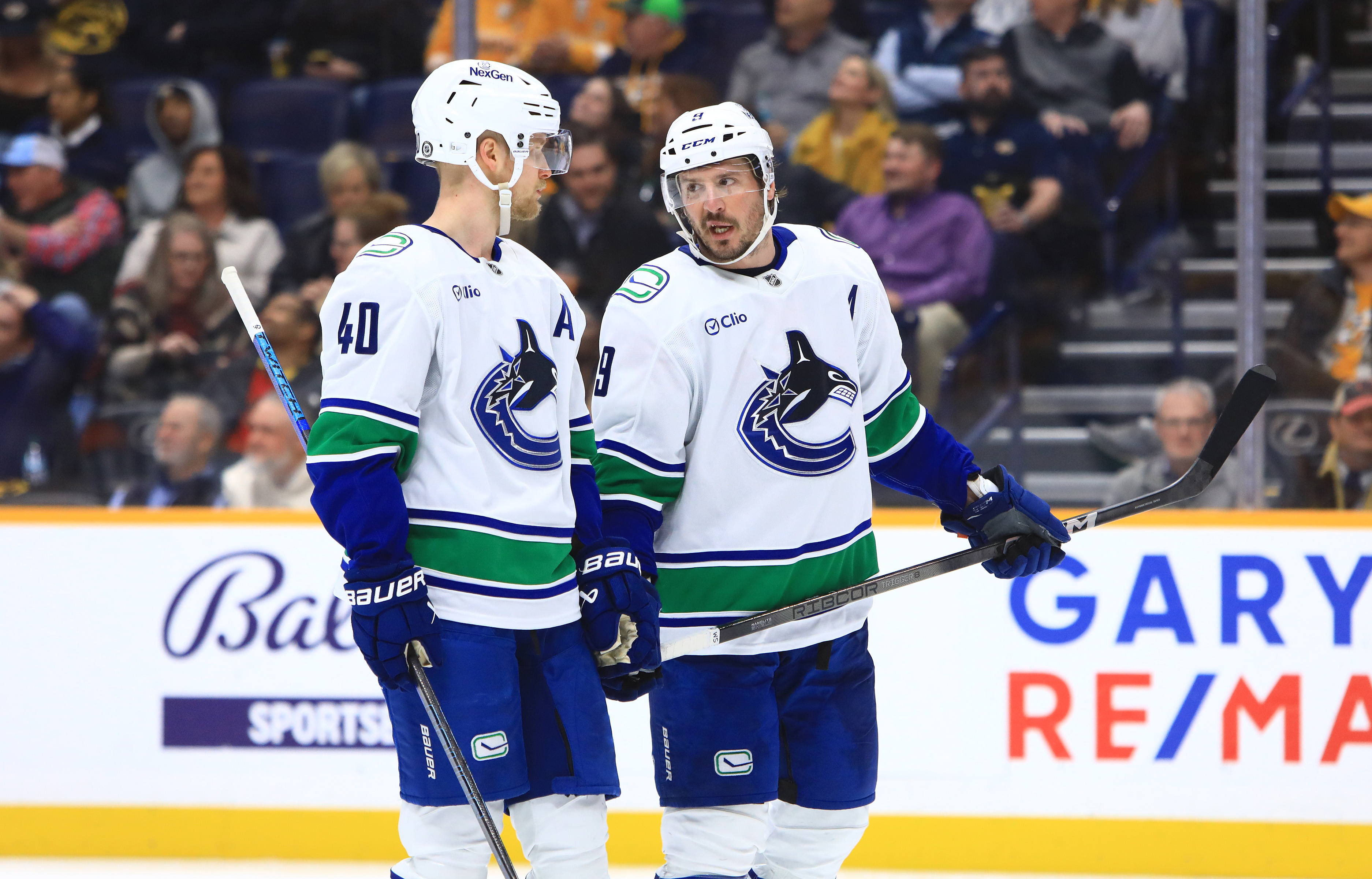 Vancouver Canucks center Elias Pettersson (40) and Canucks center J.T. Miller (9) talk during the NHL game between the Nashville Predators and Vancouver Canucks, held on January 29, 2025, at Bridgestone Arena in Nashville, Tennessee.