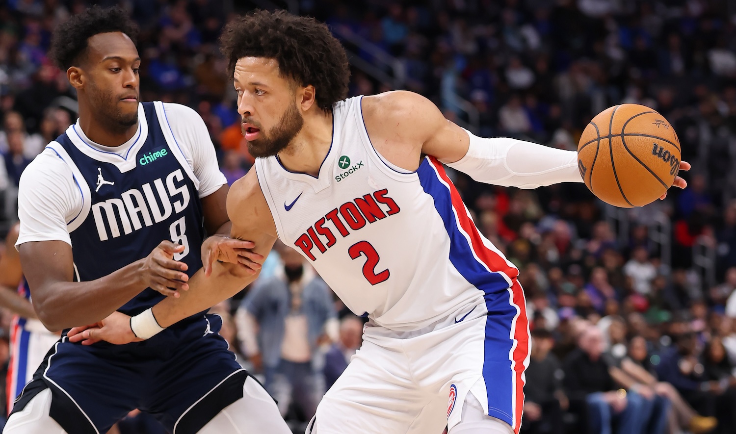 DETROIT, MICHIGAN - JANUARY 31: Cade Cunningham #2 of the Detroit Pistons looks to drive around Olivier-Maxence Prosper #8 of the Dallas Mavericks during the second half at Little Caesars Arena on January 31, 2025 in Detroit, Michigan. Detroit won the game 117-102. NOTE TO USER: User expressly acknowledges and agrees that, by downloading and or using this photograph, User is consenting to the terms and conditions of the Getty Images License. (Photo by Gregory Shamus/Getty Images)