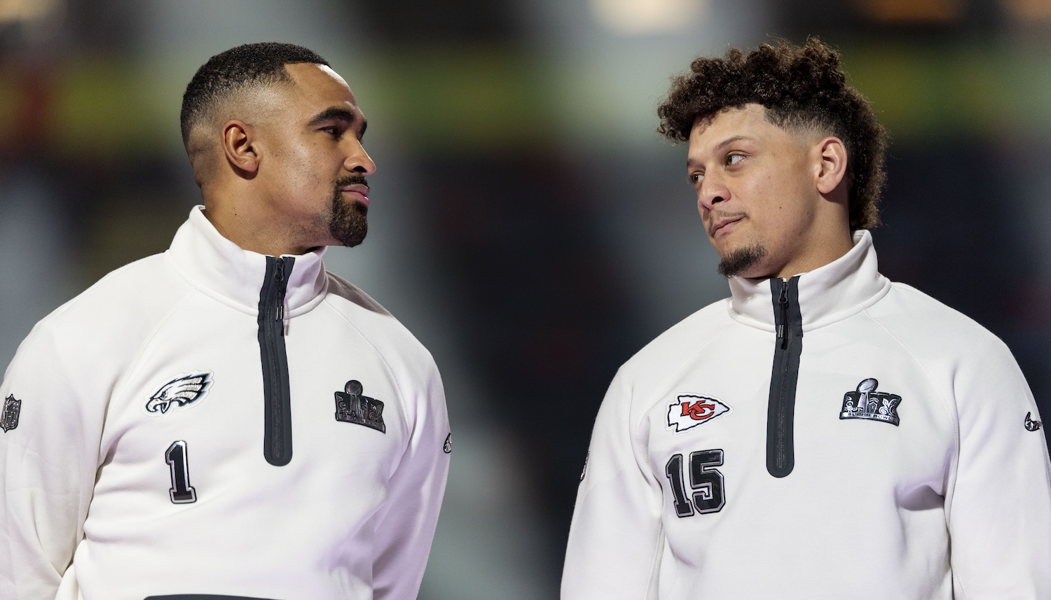 NEW ORLEANS, LOUISIANA - FEBRUARY 03: Jalen Hurts #1 of the Philadelphia Eagles and Patrick Mahomes #15 of the Kansas City Chiefs chat on stage during Super Bowl LIX Opening Night at Caesars Superdome on February 03, 2025 in New Orleans, Louisiana. (Photo by Michael Owens/Getty Images)