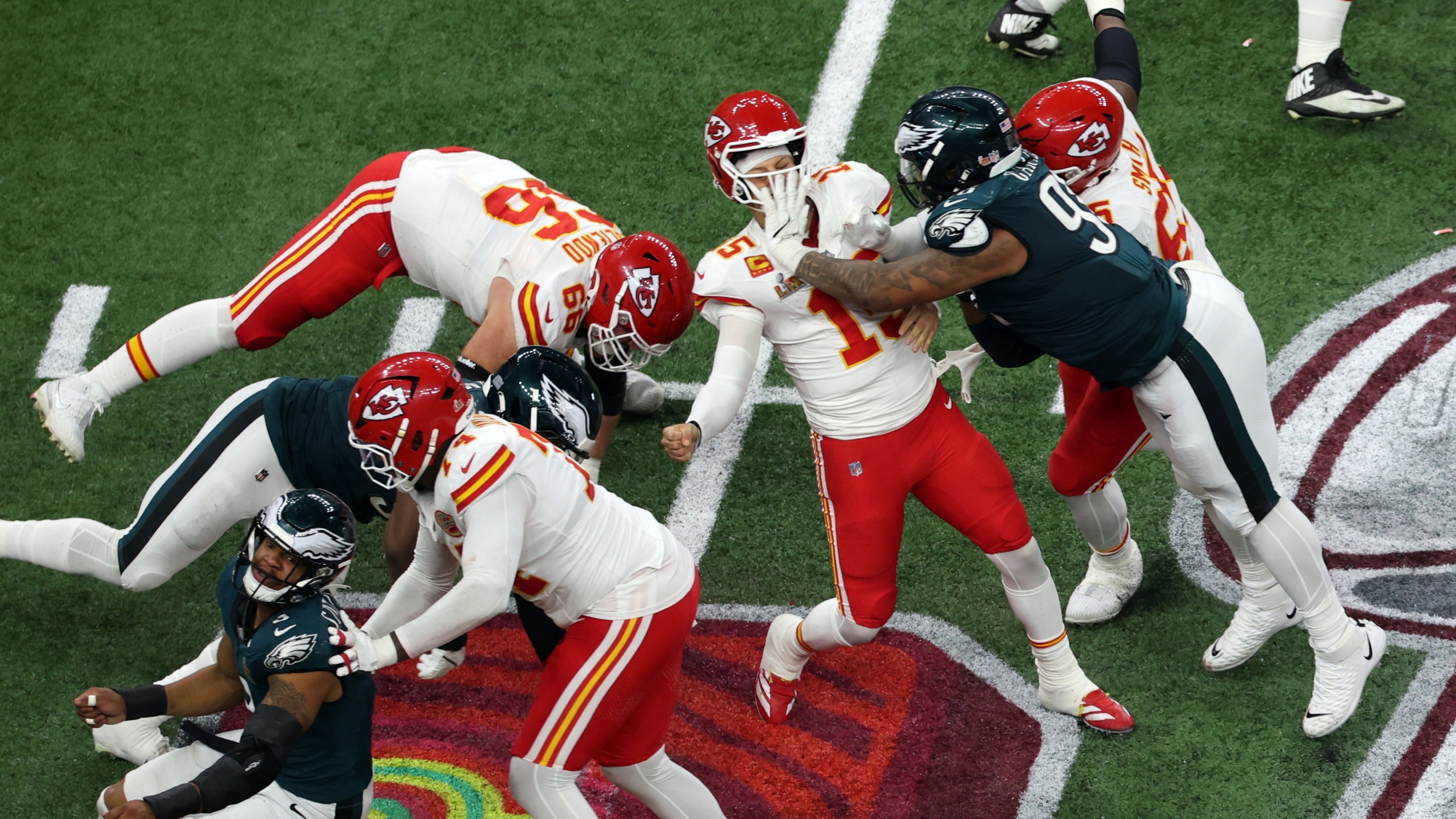 NEW ORLEANS, LA - FEBRUARY 09: DT Milton Williams #93 of the Philadelphia Eagles strips the ball away from QB Patrick Mahomes #15 of the Kansas City Chiefs for a fumble and a turnover in the fourth quarter during Super Bowl LIX between the Philadelphia Eagles and the Kansas City Chiefs on February 09, 2025, at the Caesars Superdome in New Orleans, LA. (Photo by David Buono/Icon Sportswire)