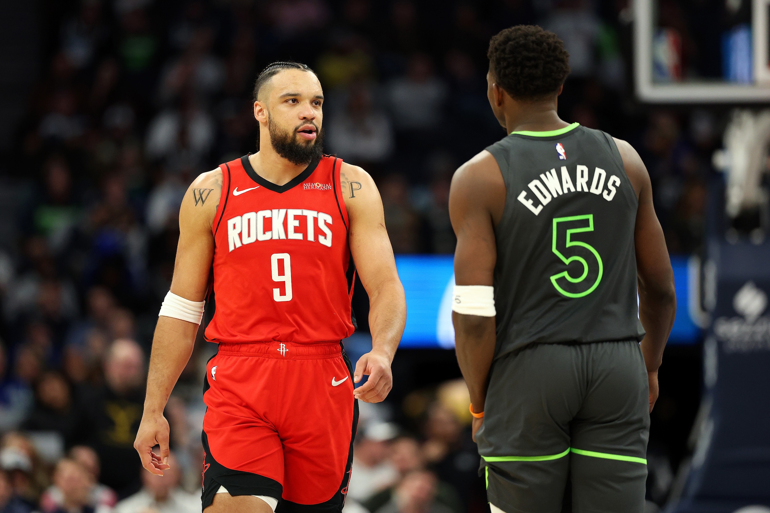 Dillon Brooks and Anthony Edwards look at each other.