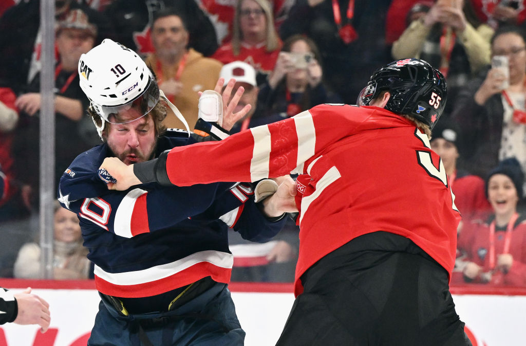 J.T. Miller #10 of Team USA and Colton Parayko #55 of Team Canada fight