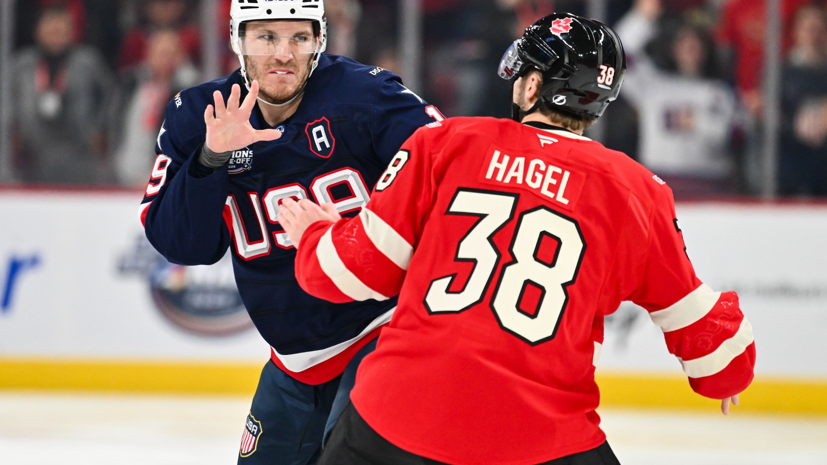 Matthew Tkachuk #19 of Team USA and Brandon Hagel #38 of Team Canada fight during the first period in the 2025 NHL 4 Nations Face-Off on February 15, 2025.