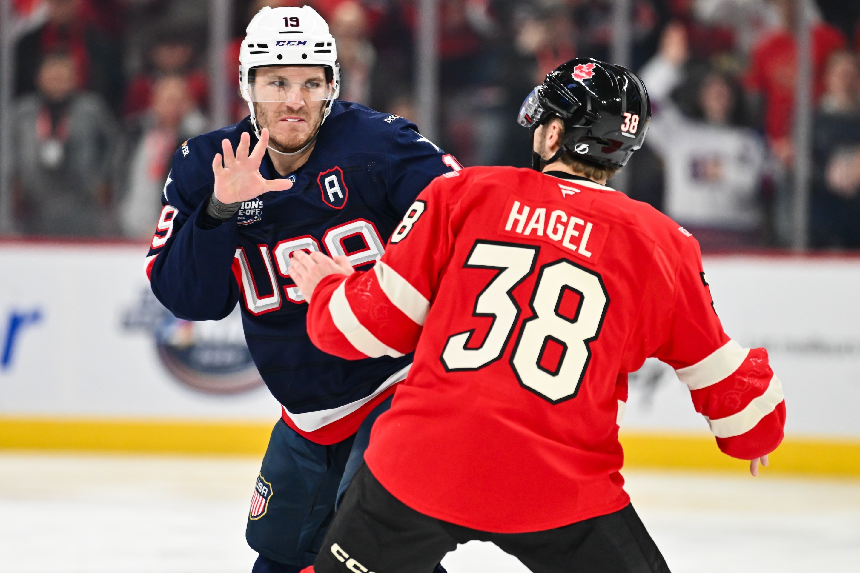 Matthew Tkachuk #19 of Team USA and Brandon Hagel #38 of Team Canada fight during the first period in the 2025 NHL 4 Nations Face-Off on February 15, 2025.