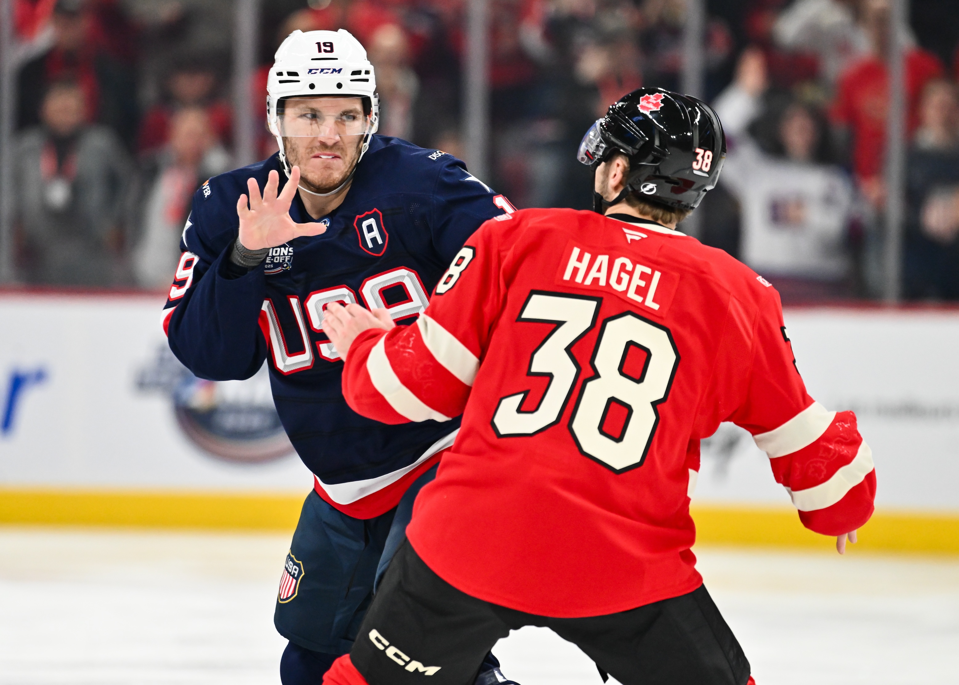 Matthew Tkachuk #19 of Team USA and Brandon Hagel #38 of Team Canada fight during the first period in the 2025 NHL 4 Nations Face-Off on February 15, 2025.