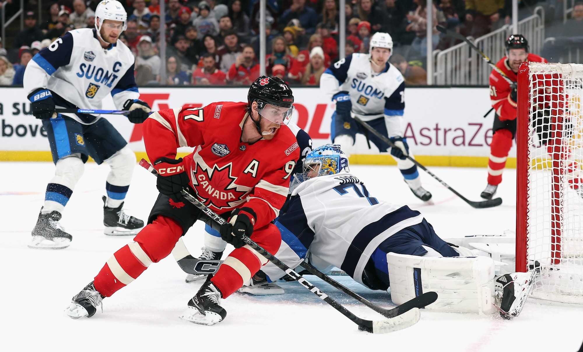 BOSTON, MASSACHUSETTS - FEBRUARY 17: Connor McDavid #97 of Team Canada carries the puck against Juuse Saros #74 of Team Finland during the second period in the 4 Nations Face-Off game at TD Garden on February 17, 2025 in Boston, Massachusetts. (Photo by Maddie Meyer/Getty Images)