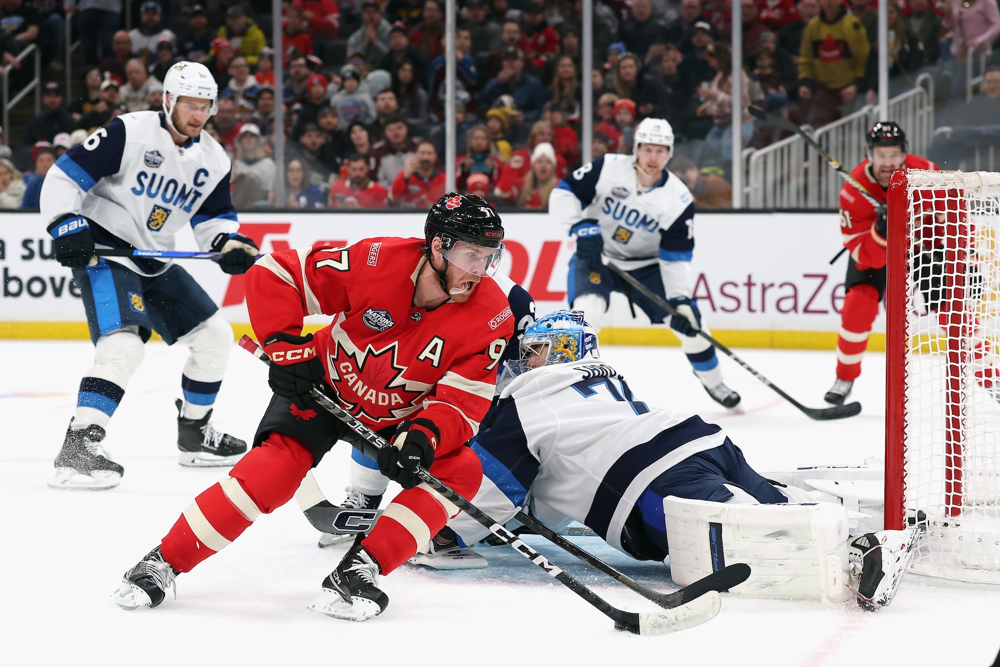 BOSTON, MASSACHUSETTS - FEBRUARY 17: Connor McDavid #97 of Team Canada carries the puck against Juuse Saros #74 of Team Finland during the second period in the 4 Nations Face-Off game at TD Garden on February 17, 2025 in Boston, Massachusetts. (Photo by Maddie Meyer/Getty Images)