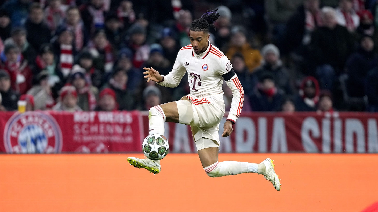 Michael Olise of Bayern Munich controls the ball during the UEFA Champions League 2024/25 League Knockout Play-off second leg match between FC Bayern München and Celtic FC at Allianz Arena on February 18, 2025 in Munich, Germany.