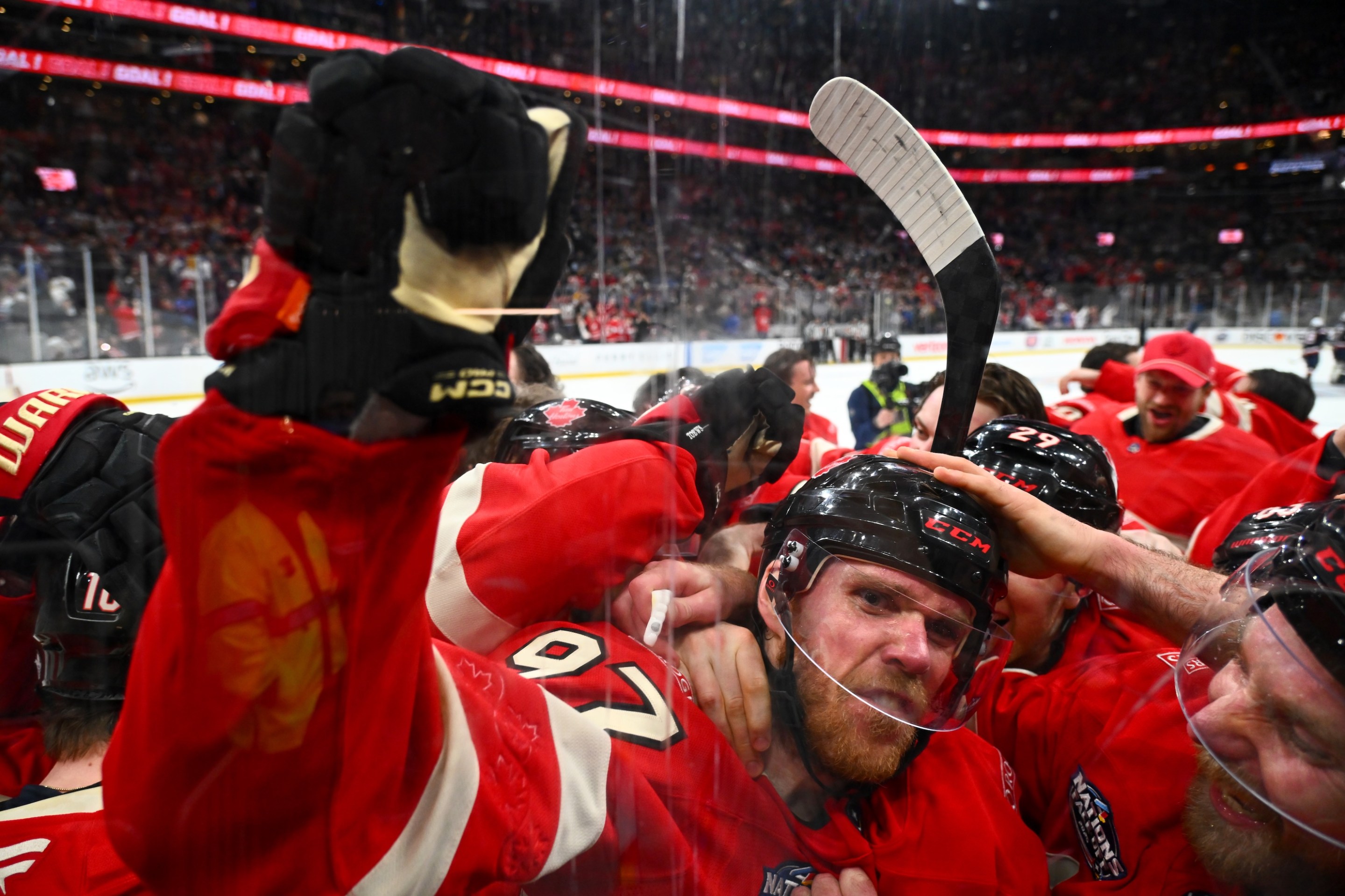 BOSTON, MASSACHUSETTS - FEBRUARY 20: Connor McDavid #97 of Team Canada celebrates with teammates after scoring the game-winning goal during the first overtime period of the 4 Nations Face-Off Championship game between Team Canada and Team United States at TD Garden on February 20, 2025 in Boston, Massachusetts. (Photo by Ben Jackson/4NFO/World Cup of Hockey via Getty Images)