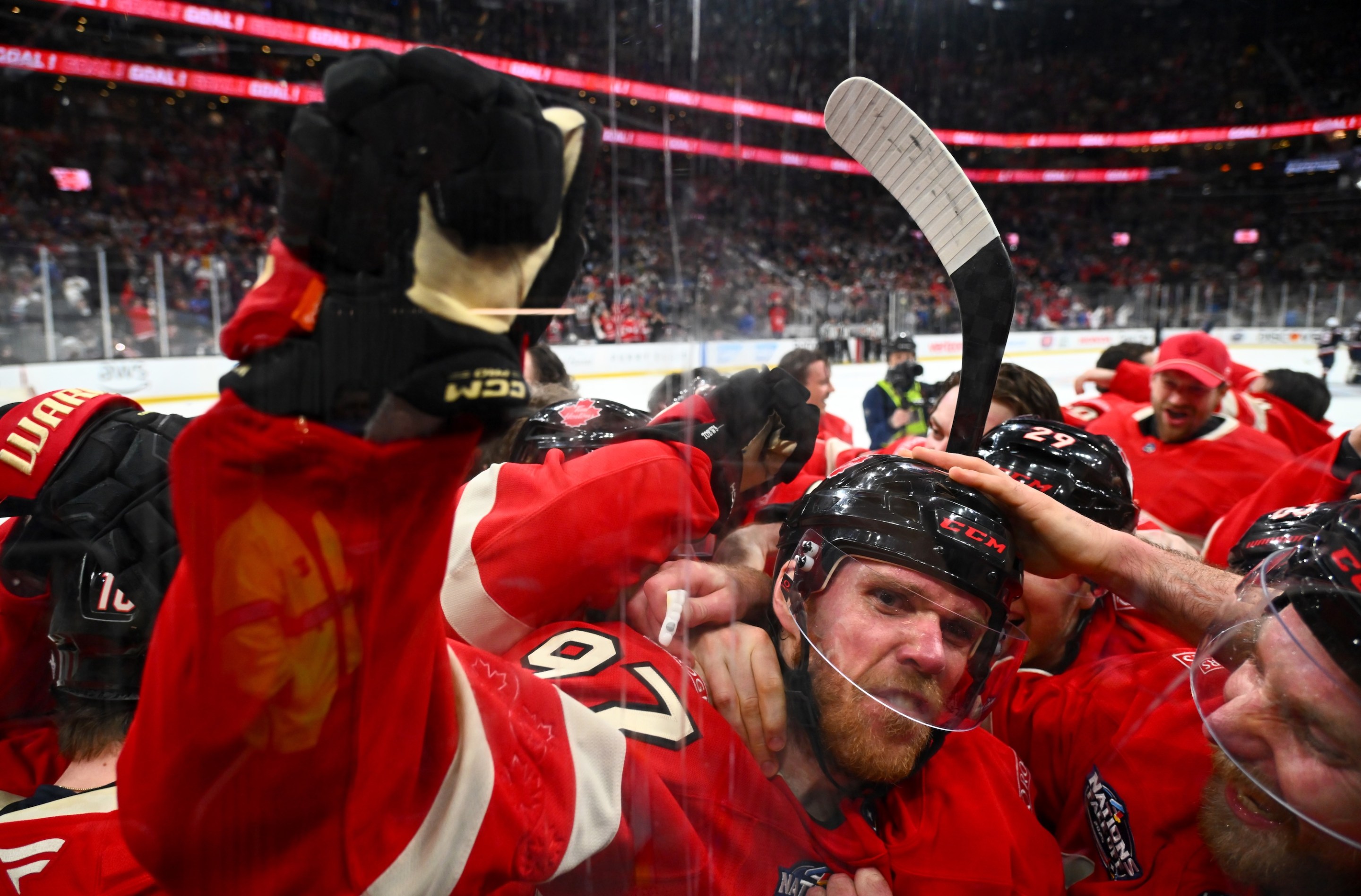 BOSTON, MASSACHUSETTS - FEBRUARY 20: Connor McDavid #97 of Team Canada celebrates with teammates after scoring the game-winning goal during the first overtime period of the 4 Nations Face-Off Championship game between Team Canada and Team United States at TD Garden on February 20, 2025 in Boston, Massachusetts. (Photo by Ben Jackson/4NFO/World Cup of Hockey via Getty Images)