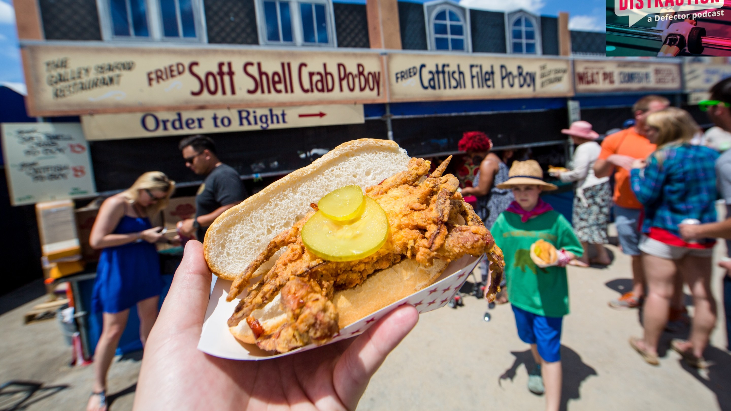 A general view of the atmosphere at the New Orleans Jazz & Heritage Festival at Fair Grounds Race Course on April 24, 2016 in New Orleans, with a fried crab po'boy front and center.