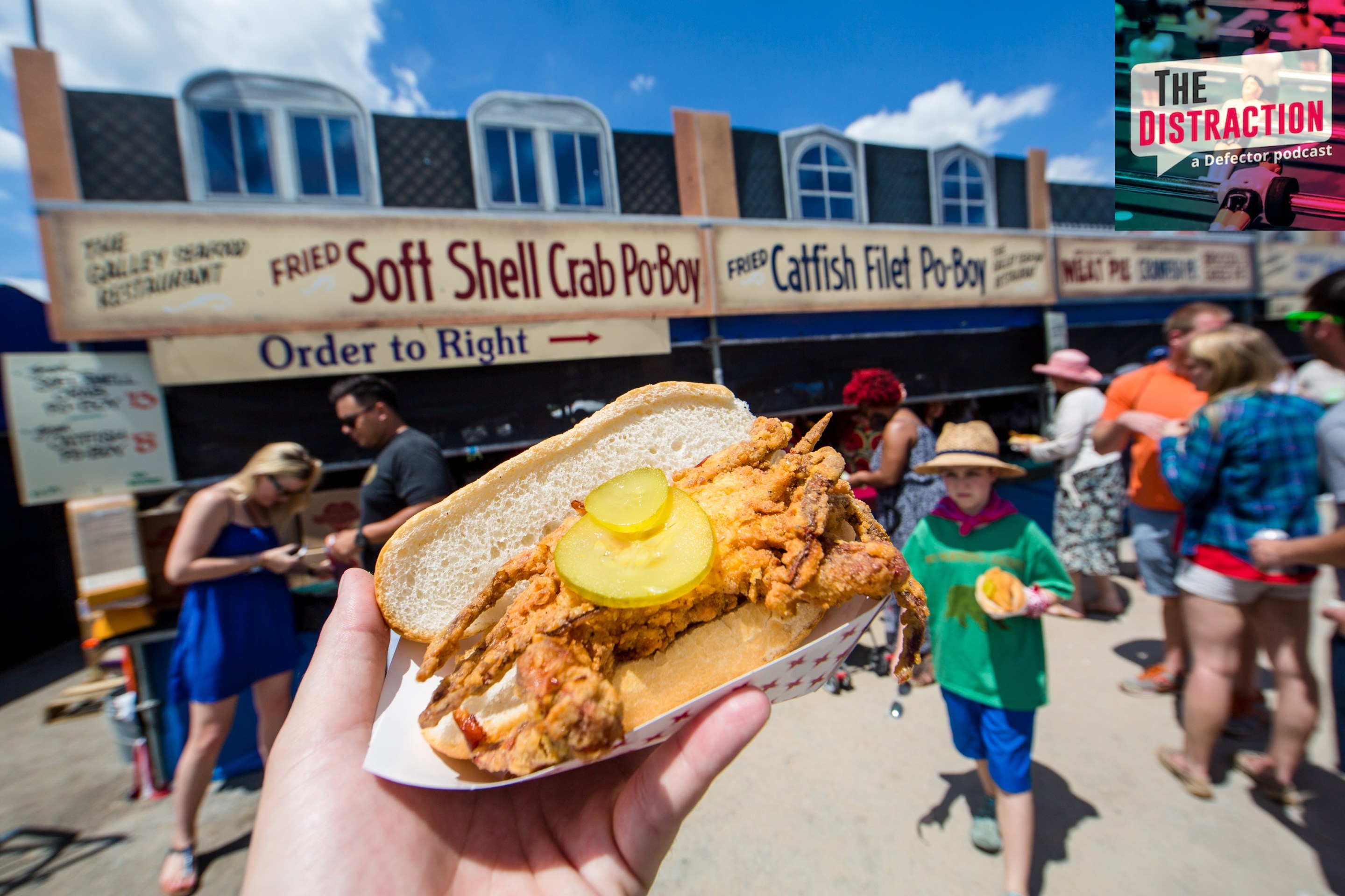 A general view of the atmosphere at the New Orleans Jazz & Heritage Festival at Fair Grounds Race Course on April 24, 2016 in New Orleans, with a fried crab po'boy front and center.