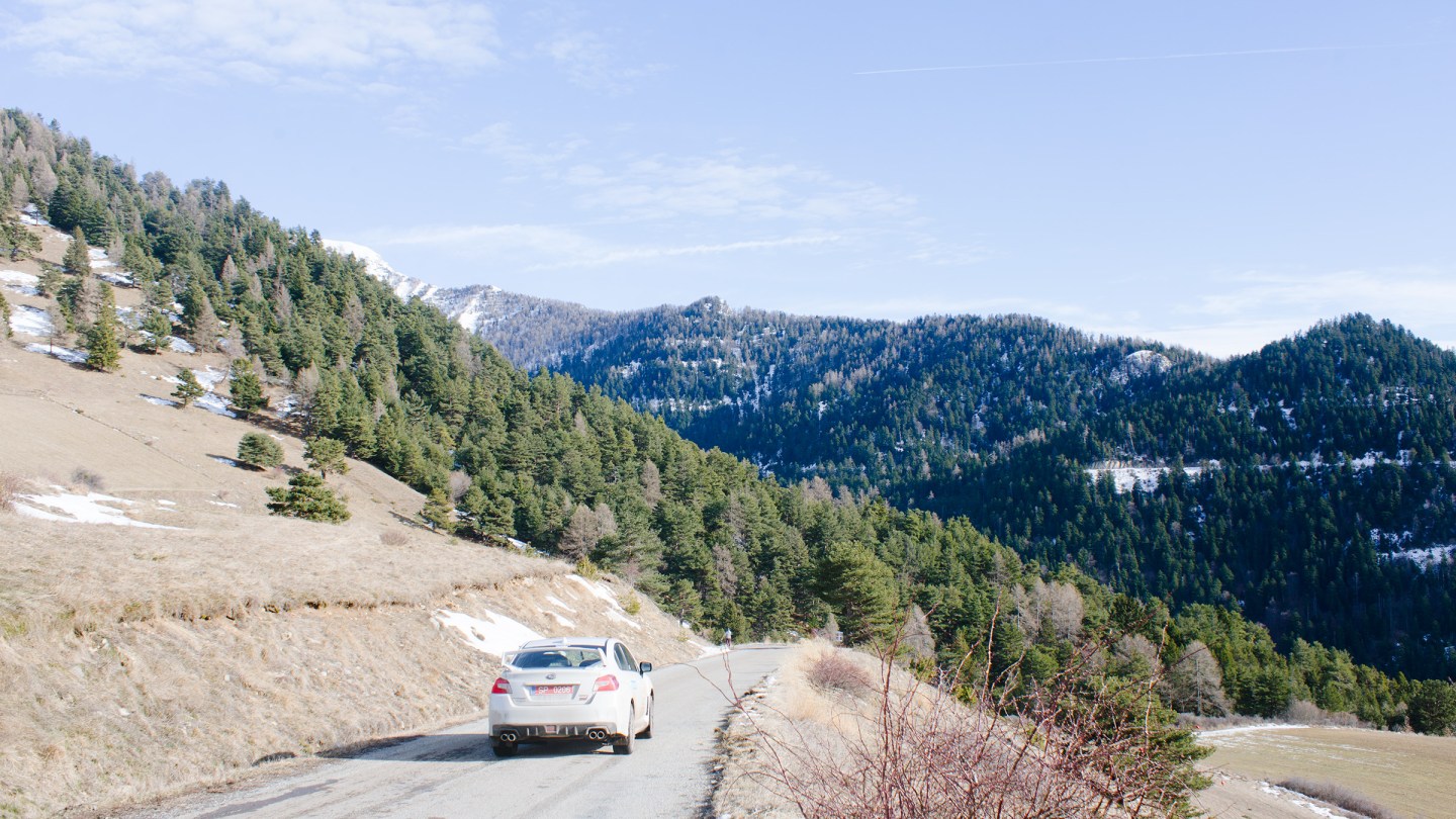 L'Estage navigates the course in a recce car