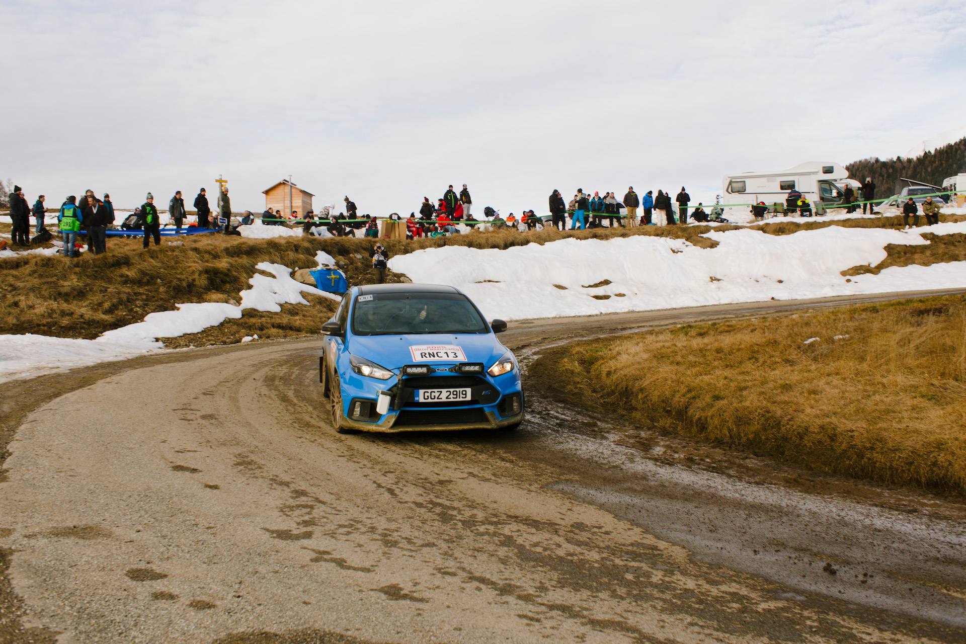 Stephane Lhonnay gives a thumbs up while driving his recce car