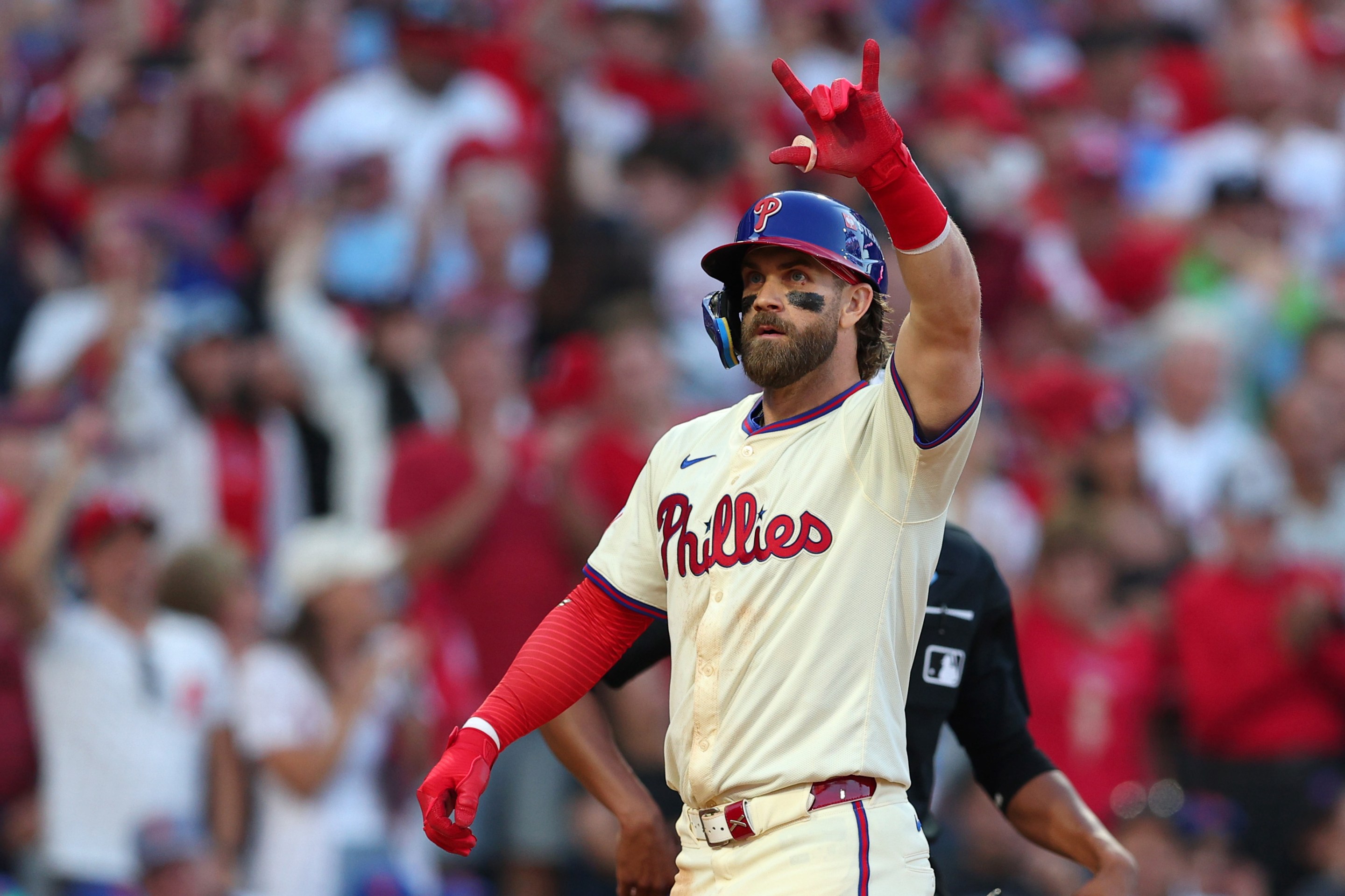 Bryce Harper #3 of the Philadelphia Phillies celebrates after hitting a two-run home run during the sixth inning against the New York Mets in Game Two of the Division Series at Citizens Bank Park on October 06, 2024 in Philadelphia, Pennsylvania.