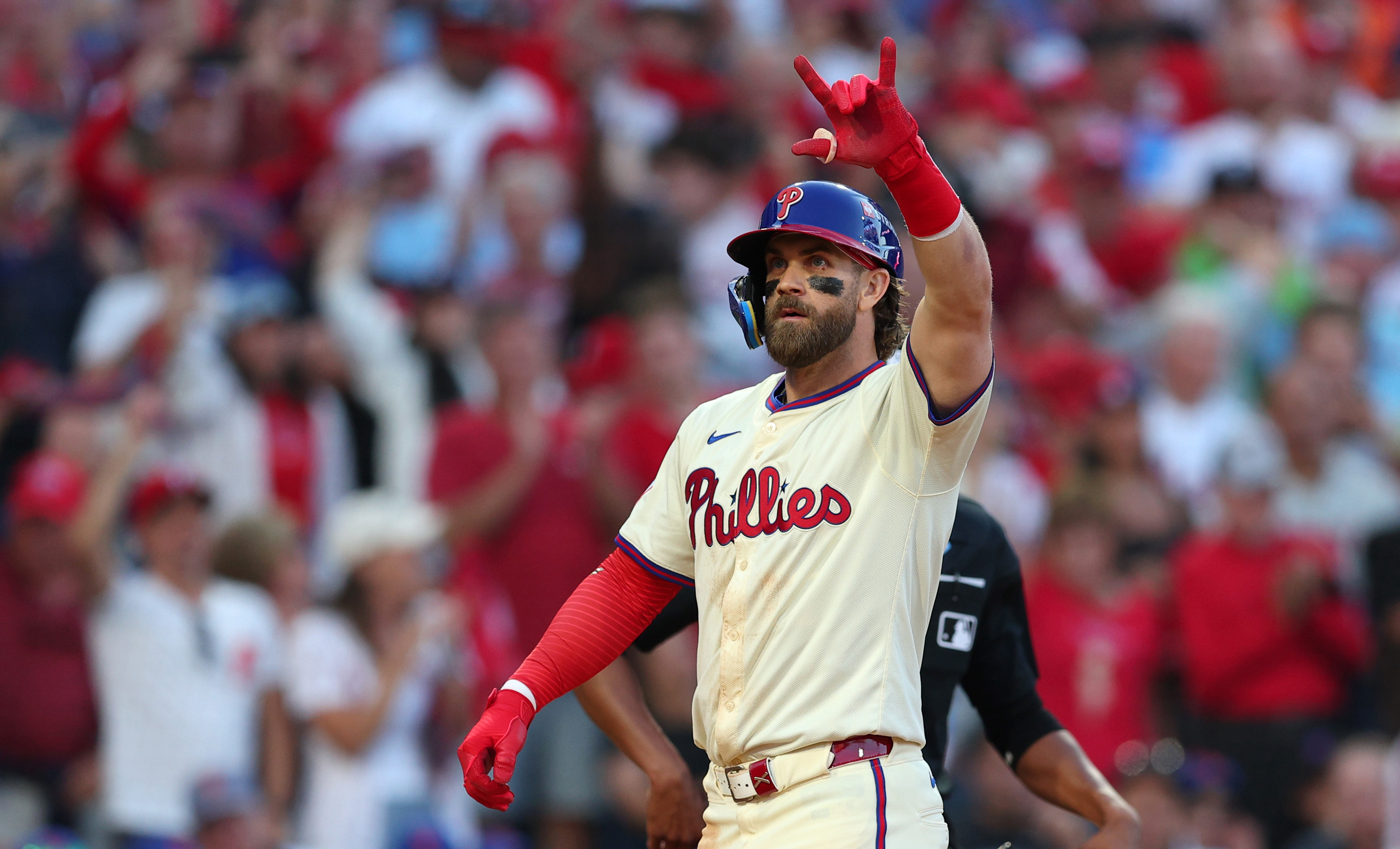 Bryce Harper #3 of the Philadelphia Phillies celebrates after hitting a two-run home run during the sixth inning against the New York Mets in Game Two of the Division Series at Citizens Bank Park on October 06, 2024 in Philadelphia, Pennsylvania.