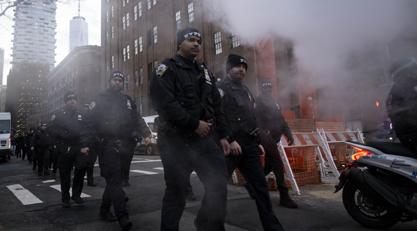 NYPD officers prepare to make arrests during a rally and a march in Manhattan to protest U.S. Immigration and Customs Enforcement (ICE) recent raids and crackdown on migrants in New York. New York City, U.S., February 13, 2025.