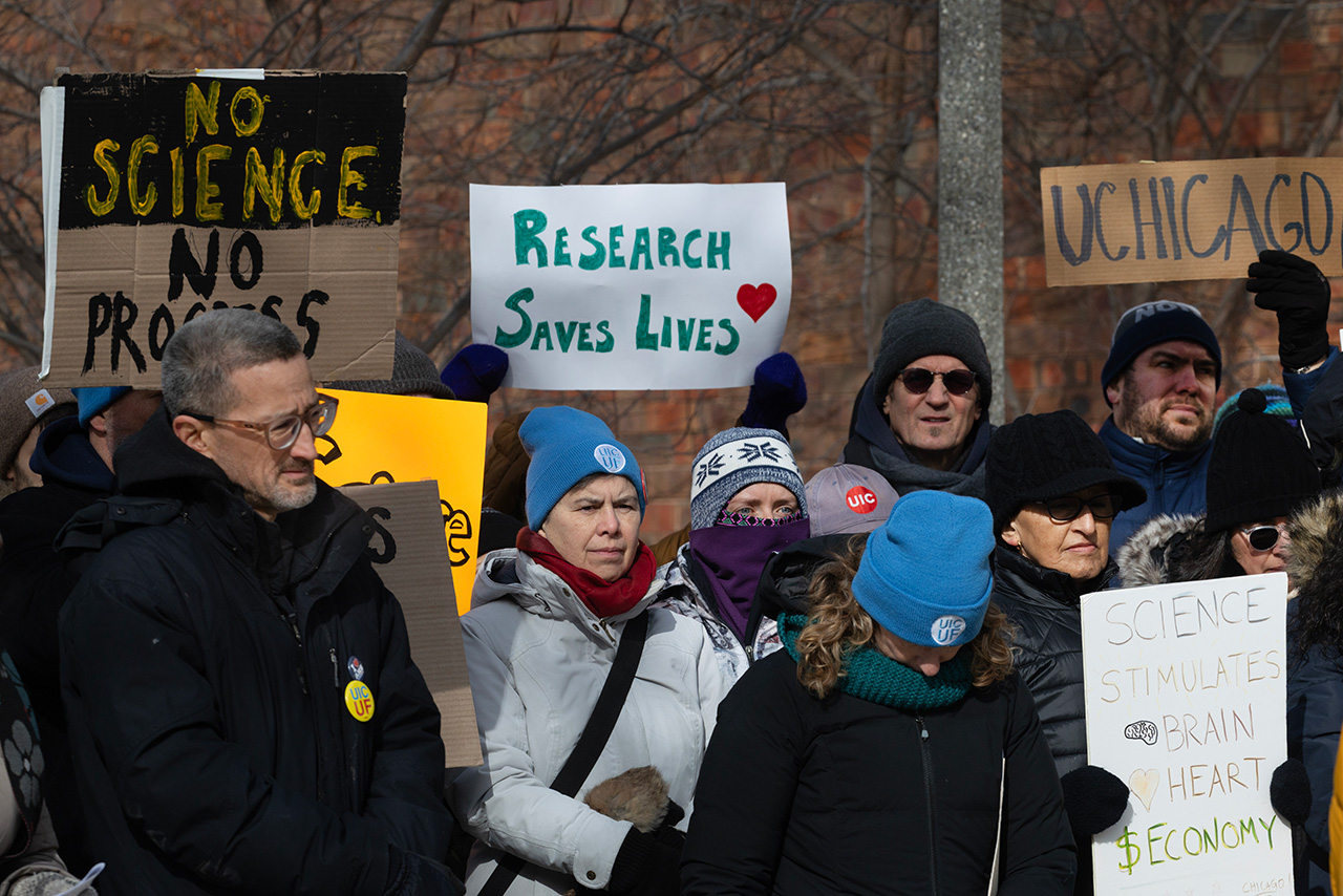 CHICAGO, ILLINOIS - FEBRUARY 19: People including researchers from Chicago area universities gather on the University of Illinois Chicago (UIC) campus to voice concerns about the potential loss of federal funding for medical research on February 19, 2025 in Chicago, Illinois. The researchers are worried about the future of their projects as the Trump administration cuts grant funding from the National Institutes of Health (NIH).