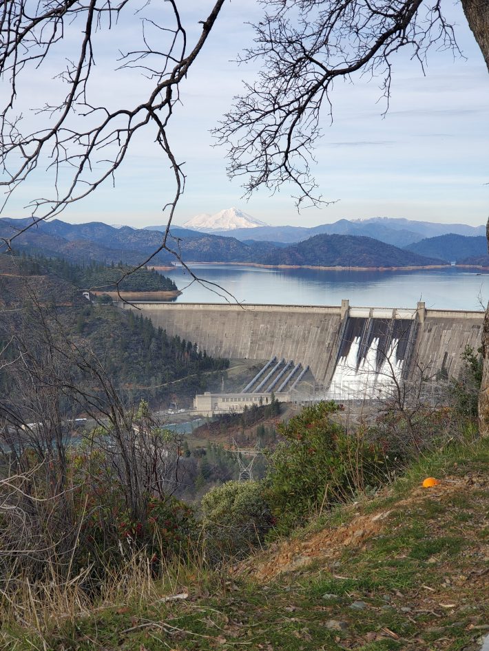 a view of the "Three Shastas: Mount Shasta, Lake Shasta, and Shasta Dam, the location of a national fish hatchery