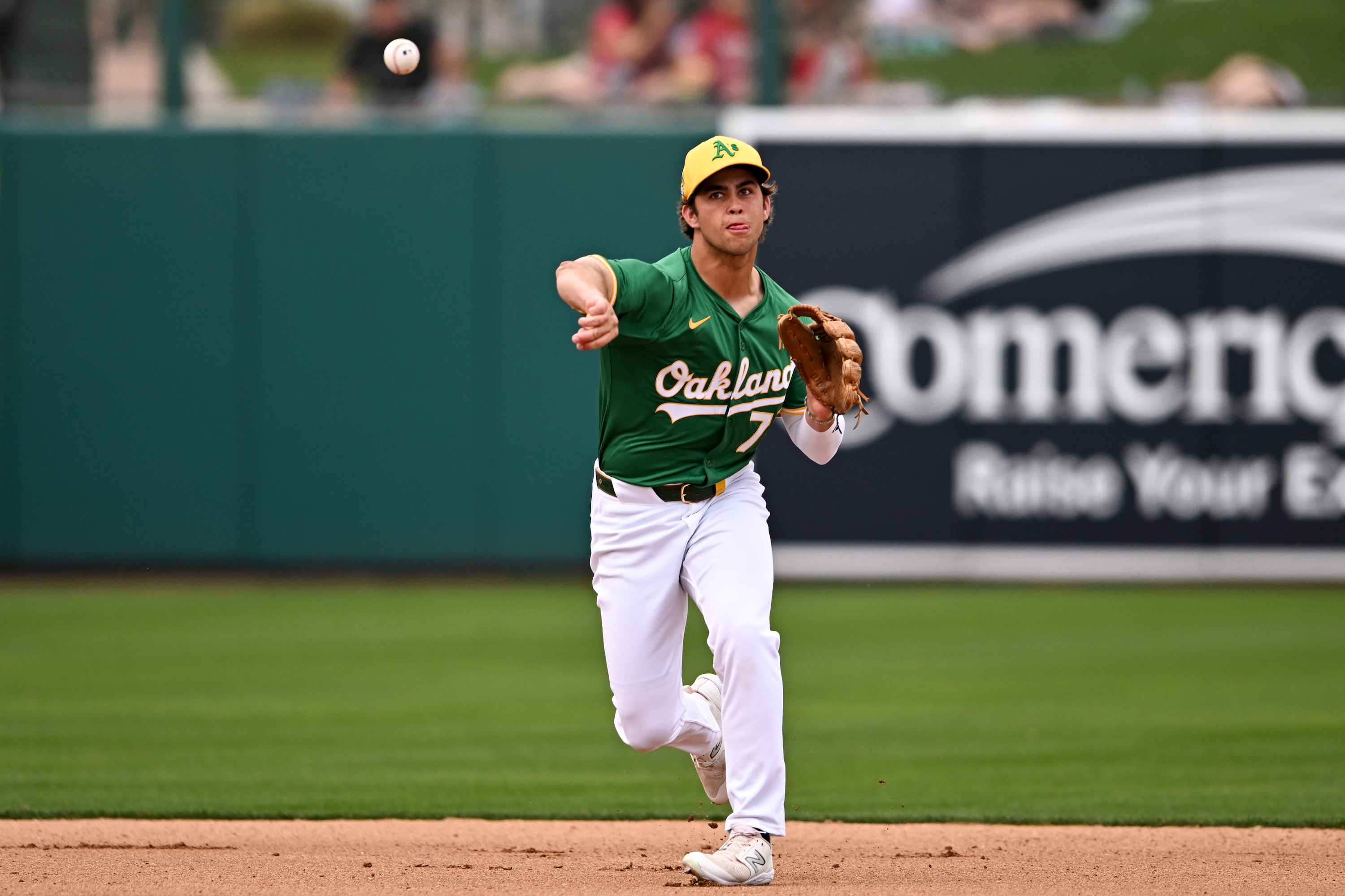 MESA, ARIZONA - MARCH 12, 2024: Max Muncy #72 of the Oakland Athletics throws to first base during the fourth inning of a spring training game against the Seattle Mariners at Hohokam Stadium on March 12, 2024 in Mesa, Arizona. (Photo by Chris Bernacchi/Diamond Images via Getty Images) *** Local Caption *** Max Muncy