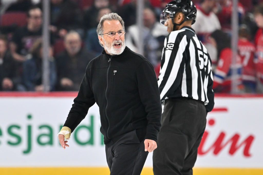 Head coach of the Philadelphia Flyers John Tortorella reacts as he walks across the ice