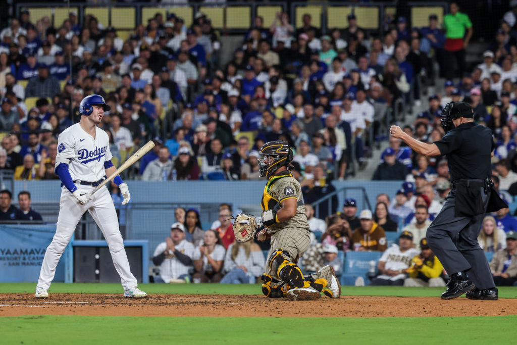 Los Angeles Dodgers second baseman Gavin Lux (9) disagrees with umpire Andy Fletcher who called him out on strikes in the sixth inning at Dodger Stadium.