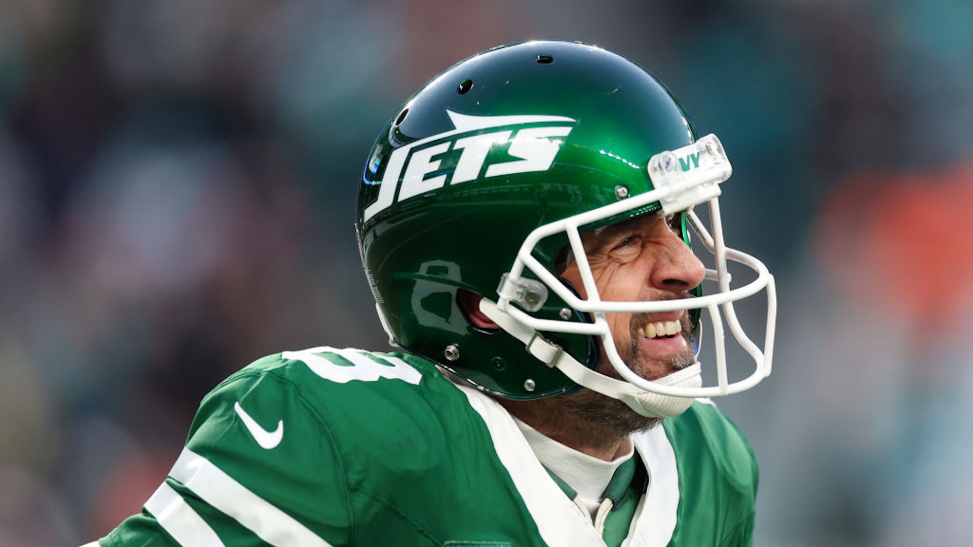 Aaron Rodgers #8 of the New York Jets reacts after throwing an interception against the Miami Dolphins during the first quarter at MetLife Stadium on January 05, 2025 in East Rutherford, New Jersey.