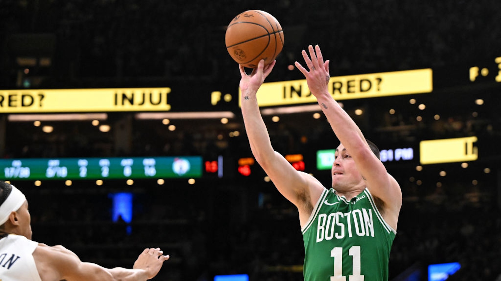 Payton Pritchard #11 of the Boston Celtics attempts a three-point basket against the New Orleans Pelicans during the second quarter at the TD Garden on January 12, 2025 in Boston, Massachusetts. NOTE TO USER: User expressly acknowledges and agrees that, by downloading and or using this photograph, User is consenting to the terms and conditions of the Getty Images License Agreement.