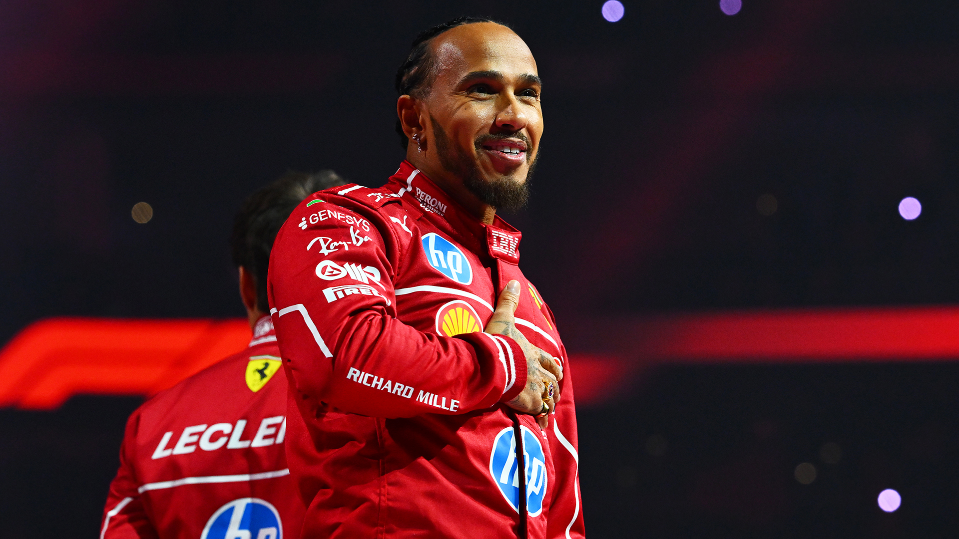 Lewis Hamilton of Great Britain and Scuderia Ferrari waves to the crowd from the stage during F1 75 Live at The O2 Arena on February 18, 2025 in London, England.