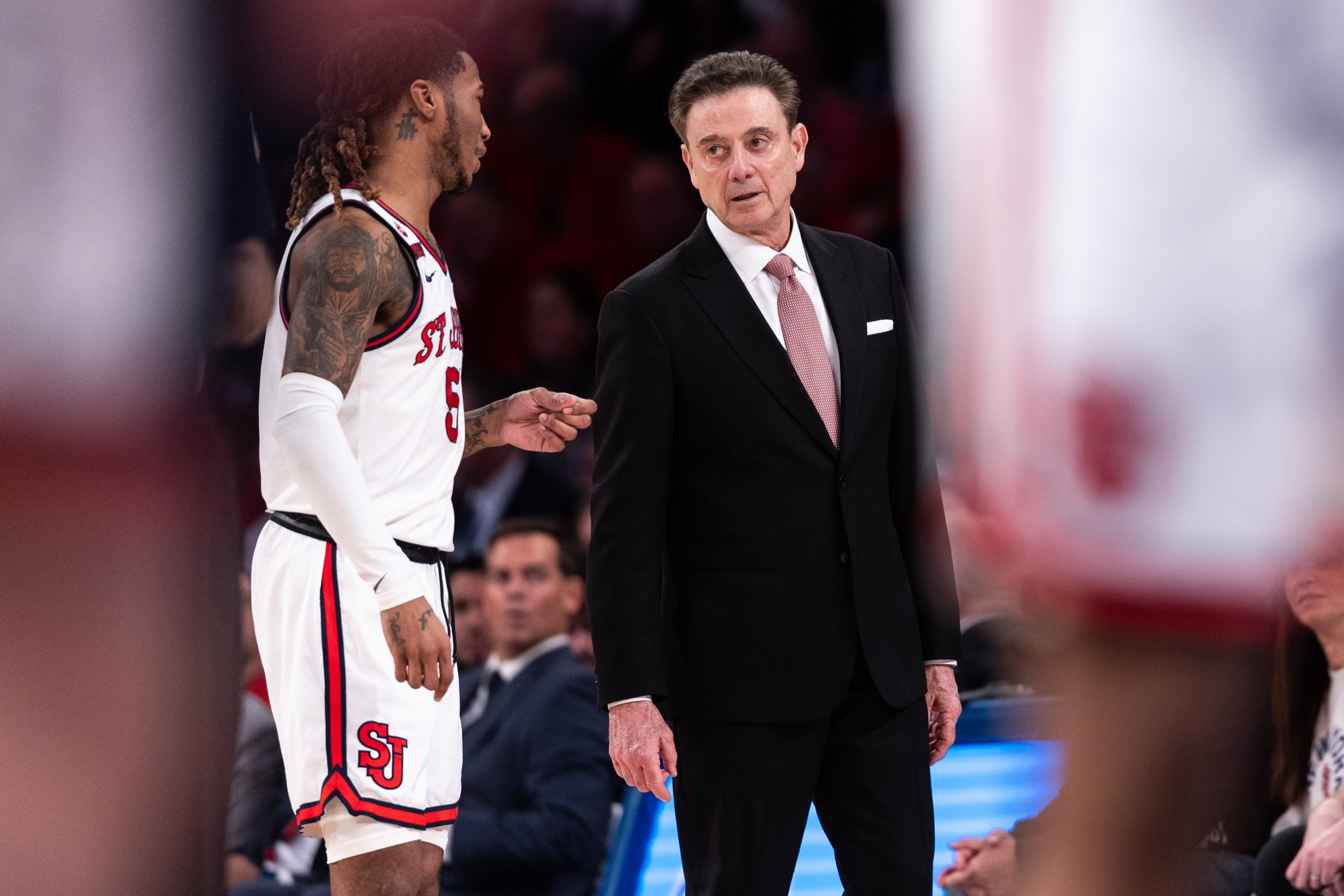 Head coach Rick Pitino of the St. John's Red Storm speaks with Deivon Smith #5 of the St. John's Red Storm during the first half of the game against the Connecticut Huskies on February 23, 2025.