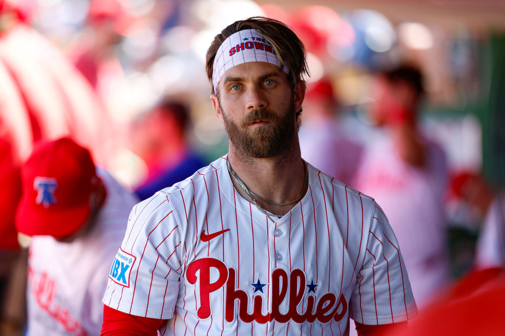 Bryce Harper #3 of the Philadelphia Phillies looks on in the dugout in the third inning during a spring training game against the Baltimore Orioles at BayCare Ballpark on March 2, 2025 in Clearwater, Florida.